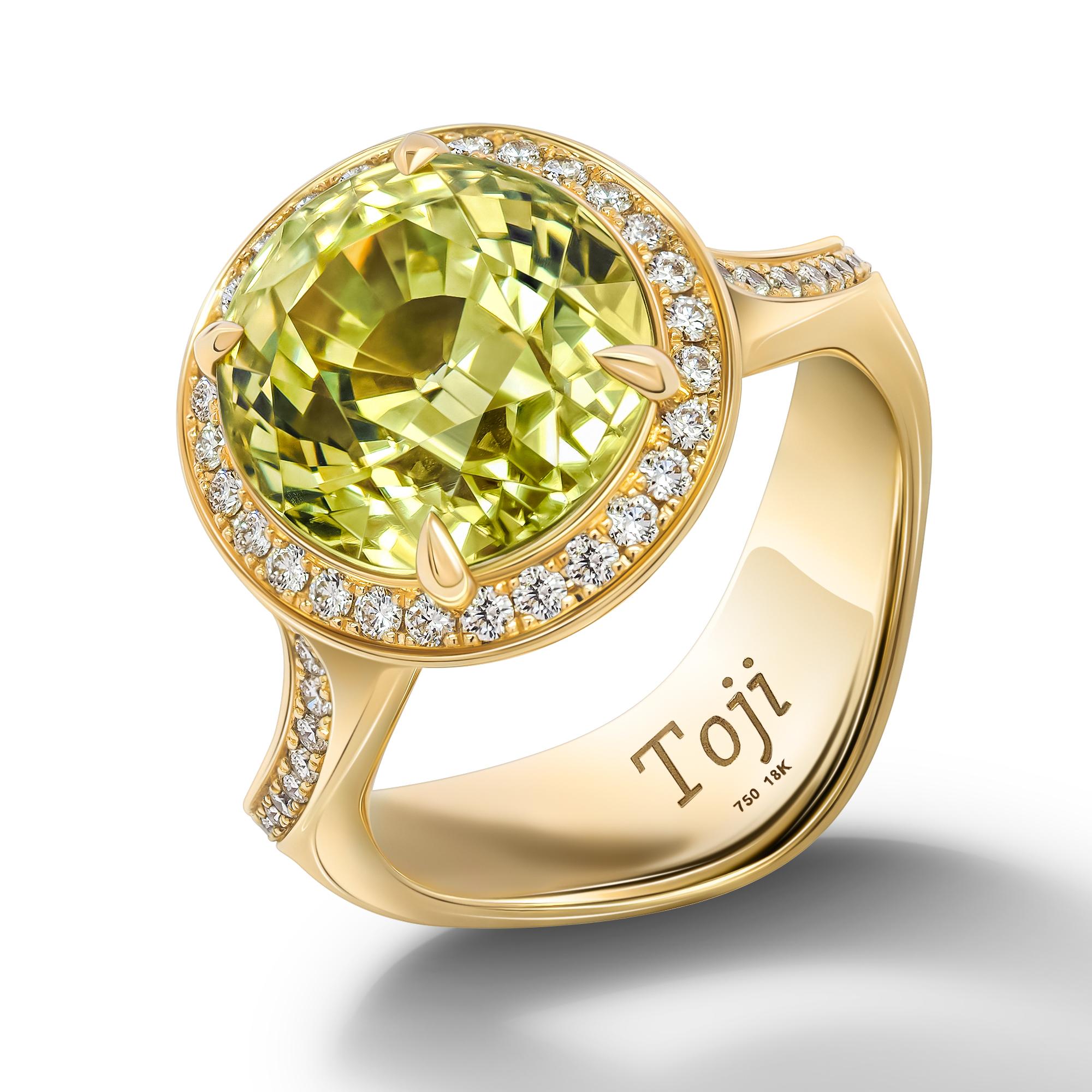 Rich color Chrysoberyl Ring 
Indian summer collection
•	18K Yellow gold.  
•	Yellow-Green Chrysoberyl in oval cut – total carat weight 8.15. 
•	Diamonds – 54 pc in round cut – total carat weight 0.38.
•	Ring size – 6.5’
•	Product weight– 9 grams.