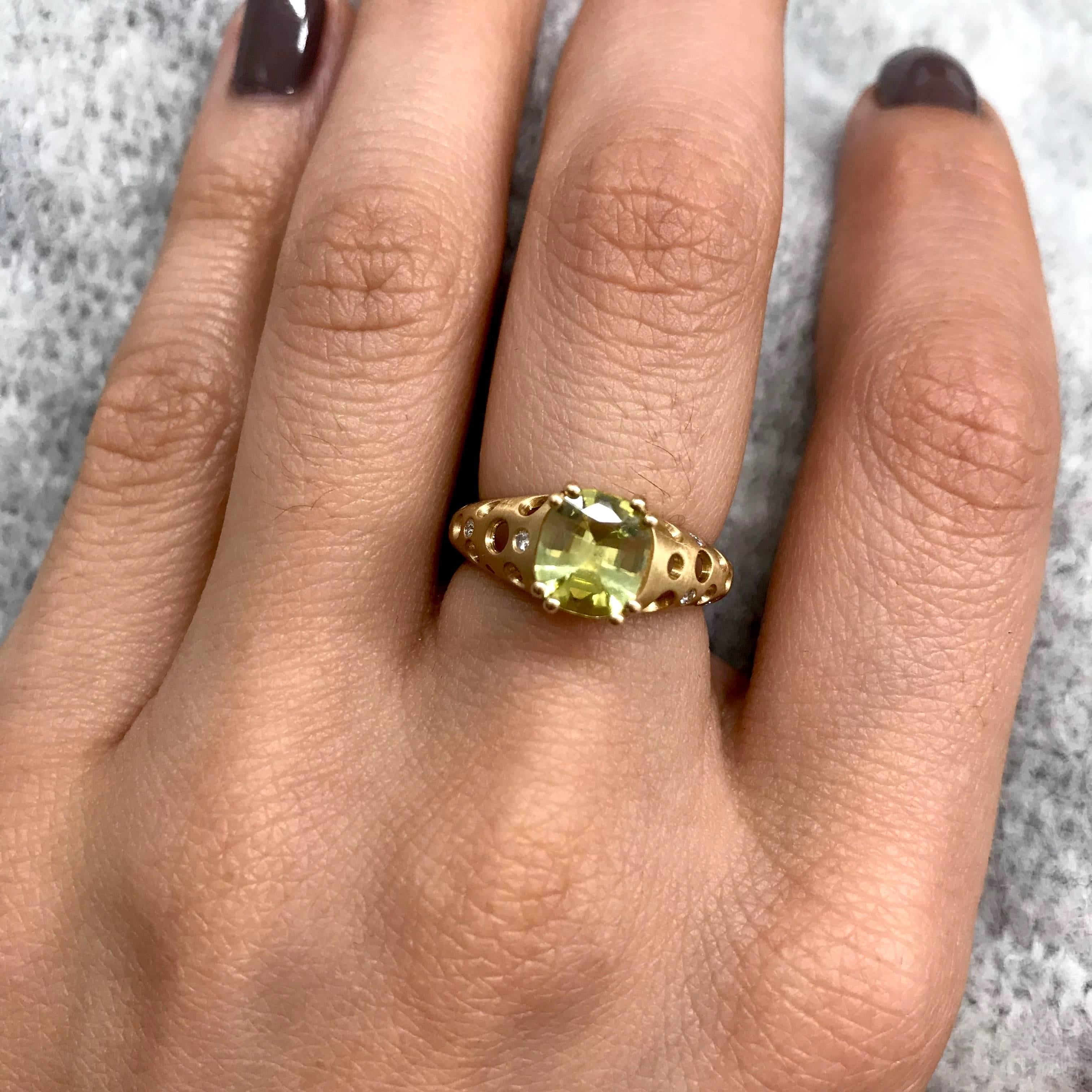 A chrysoberyl ring with a tapered oculus band. This gemstone is not well-known, but has a beautiful yellow-ish green color. With a hardness of 8.5, it is not quite as tough as a diamond, sapphire, or ruby, but is not far behind, and far exceeds the