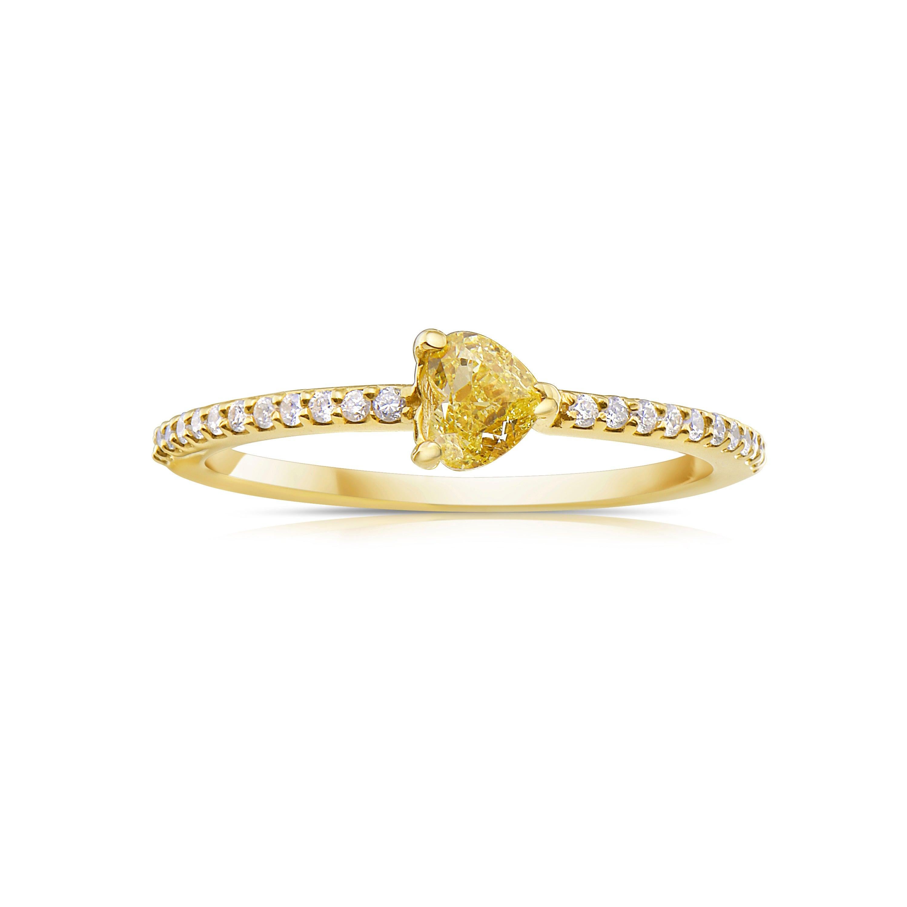 Introducing our 0.30 Carat Fancy Yellow Heart-Shaped Diamond Ring, a perfect blend of elegance and everyday luxury. Handcrafted in NYC, this stunning piece features a brilliant fancy yellow heart-shaped diamond as its centerpiece, framed by dazzling