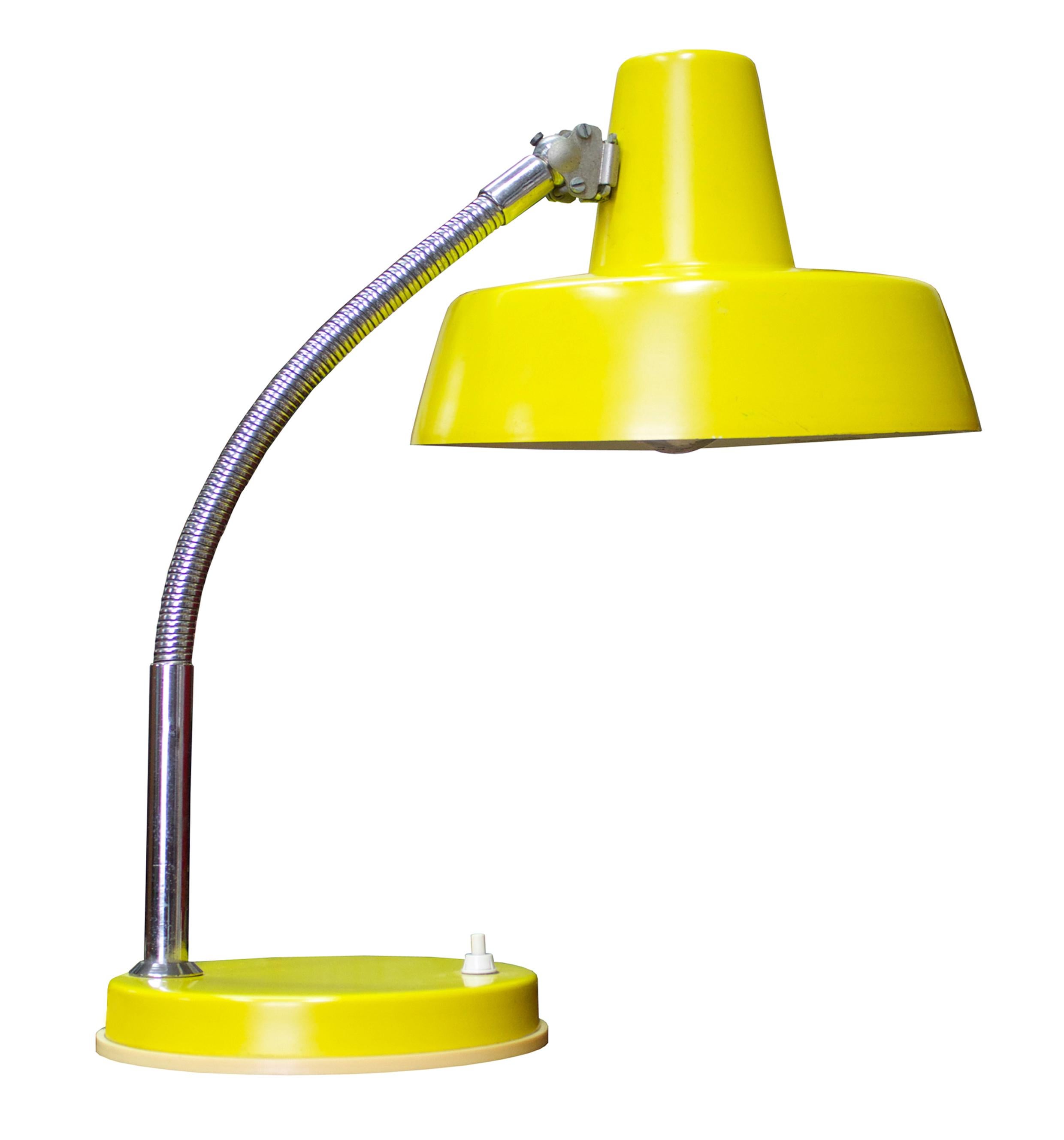 This pretty bright yellow desk lamp was made in Hungary in the 1970s. The yellow shade and the yellow stand contrast with the flexible adjustable steel rod and the white composite on and off button switch.
 