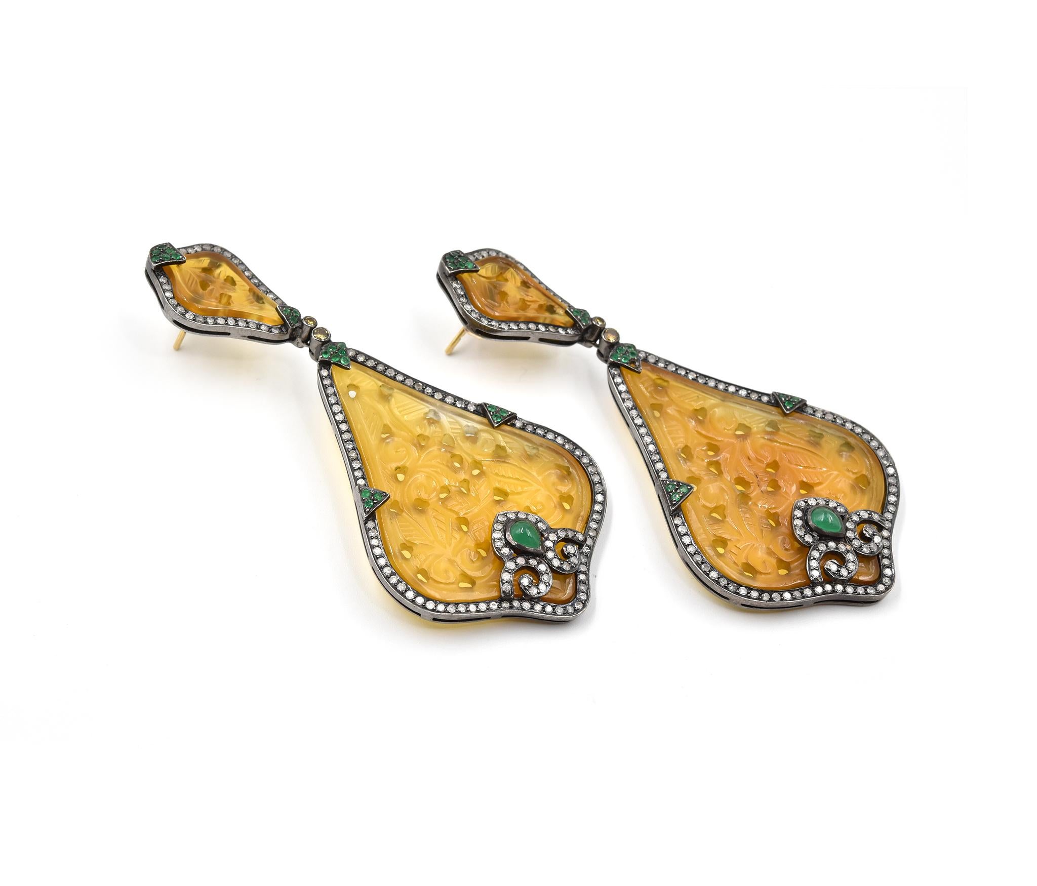 Designer: custom design
Material: 14k yellow gold & sterling silver
Diamonds: 256 round brilliant cut = 1.30 carat weight
Emeralds: 44 round and cabochon cut = 1.52 carat weight
Yellow Jade: pierced and engraved yellow jade
Fastenings: 14k yellow