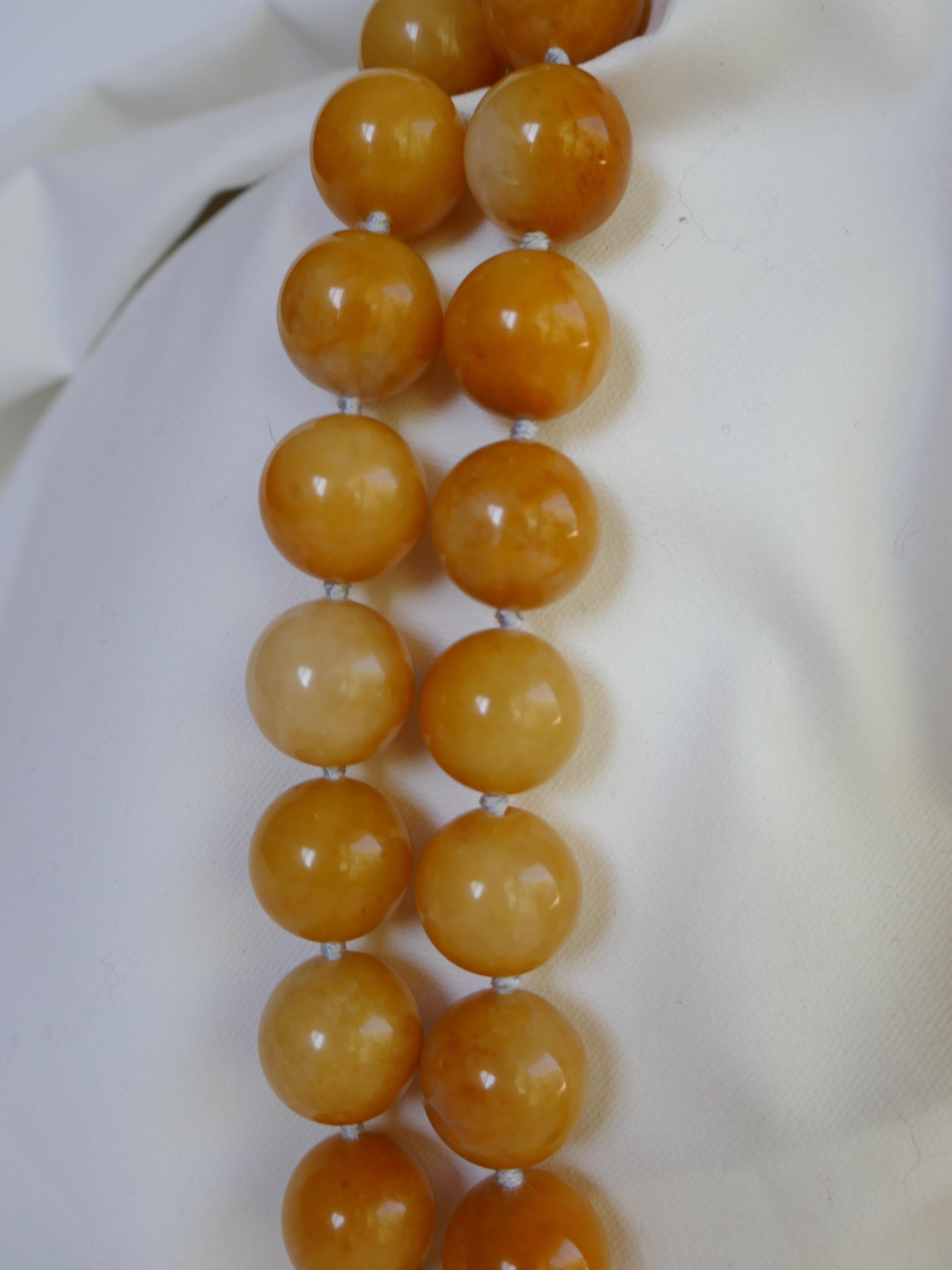 Was lucky to find a few strand of yellow jade, as most of all the pieces of yellow jade were sold. The beads on this necklace are 16mm versus the last on which was sold. This two strand necklace is made of 16mm yellow jade (mustard yellow) and