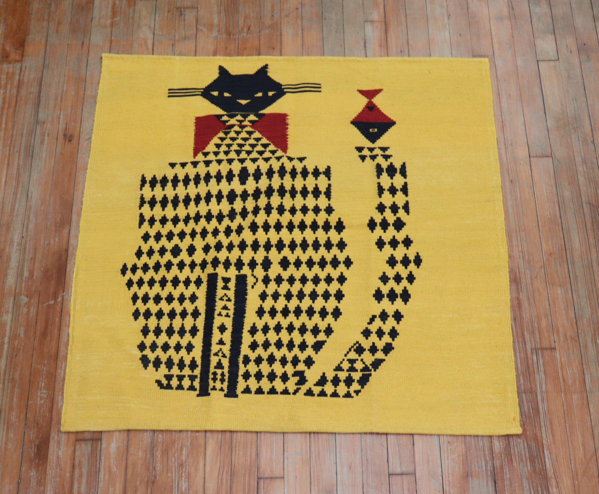 Square scatter size Persian Kilim from the mid-20th century with a kitten on a yellow field. This was originally belonging to a private Persian collector who requested to make a custom collection of flat-weaves back in the 1960s with quirky themes