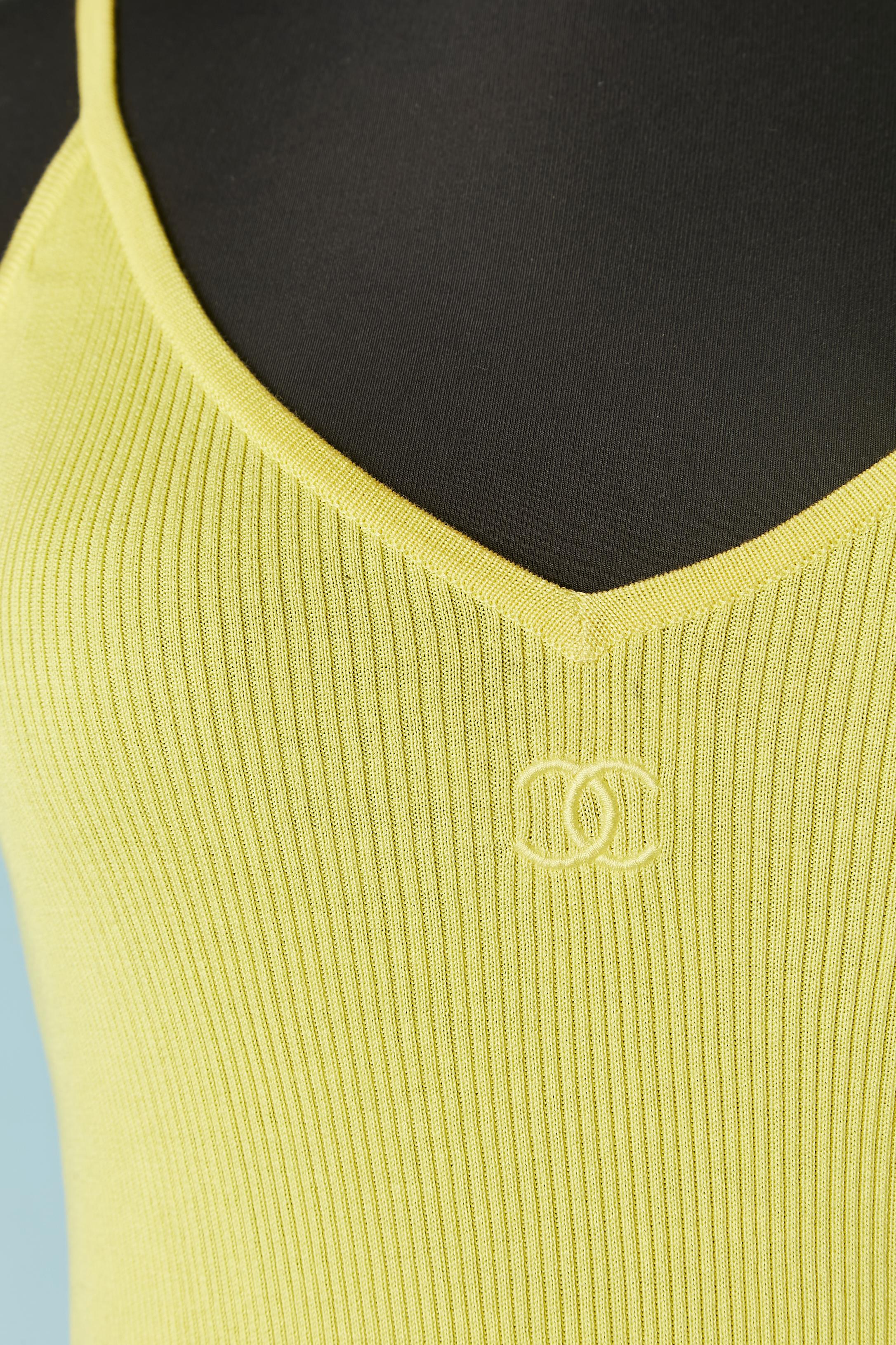 Yellow cotton knit tank-top with tread embroidery brand in the front. 
SIZE 42 (Fr) on tag but fit more likely S 