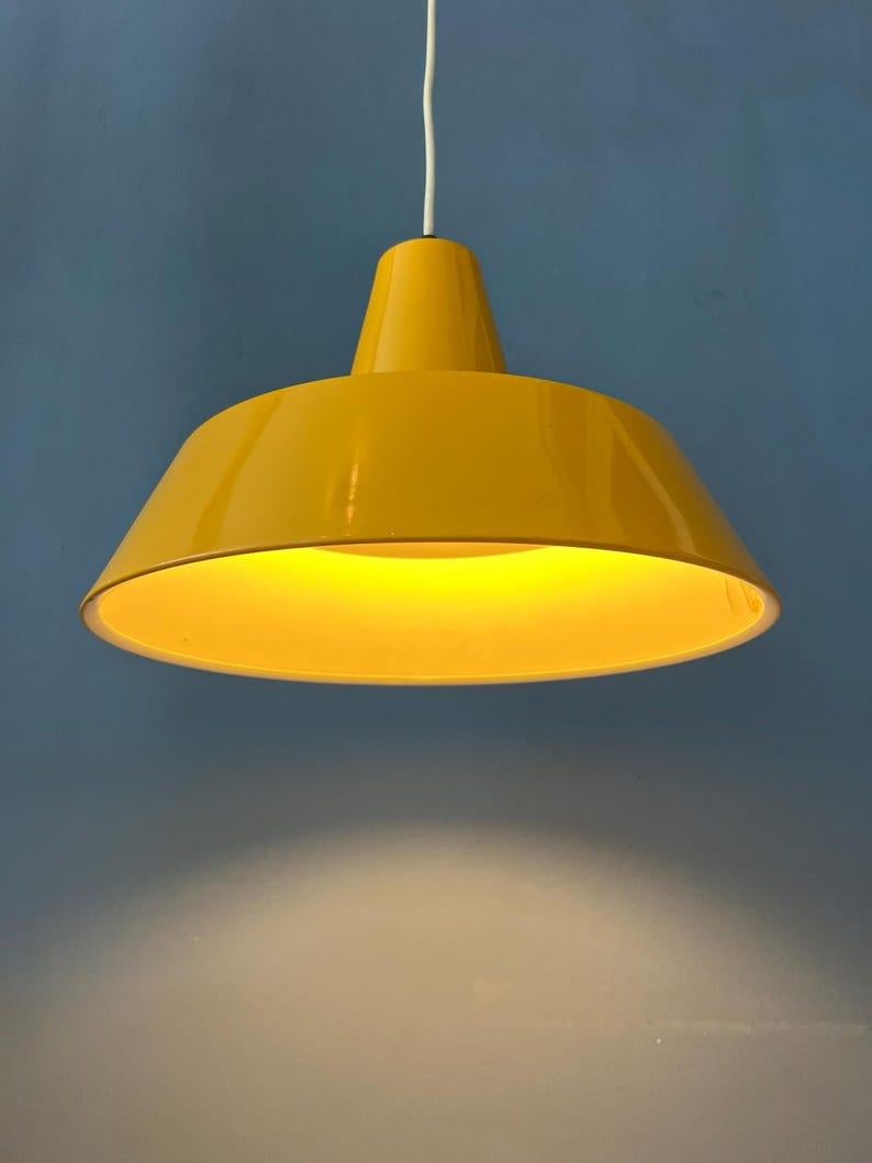 Classic industrial orange pendant lamp in the style of Louis Poulsen 'Arbejdspendel'. The lamp is made out of steel and has a thick yellow alcquer The lamp requires one E27/26 (standard) lightbulb. Please don't hesitate to get in touch if you have