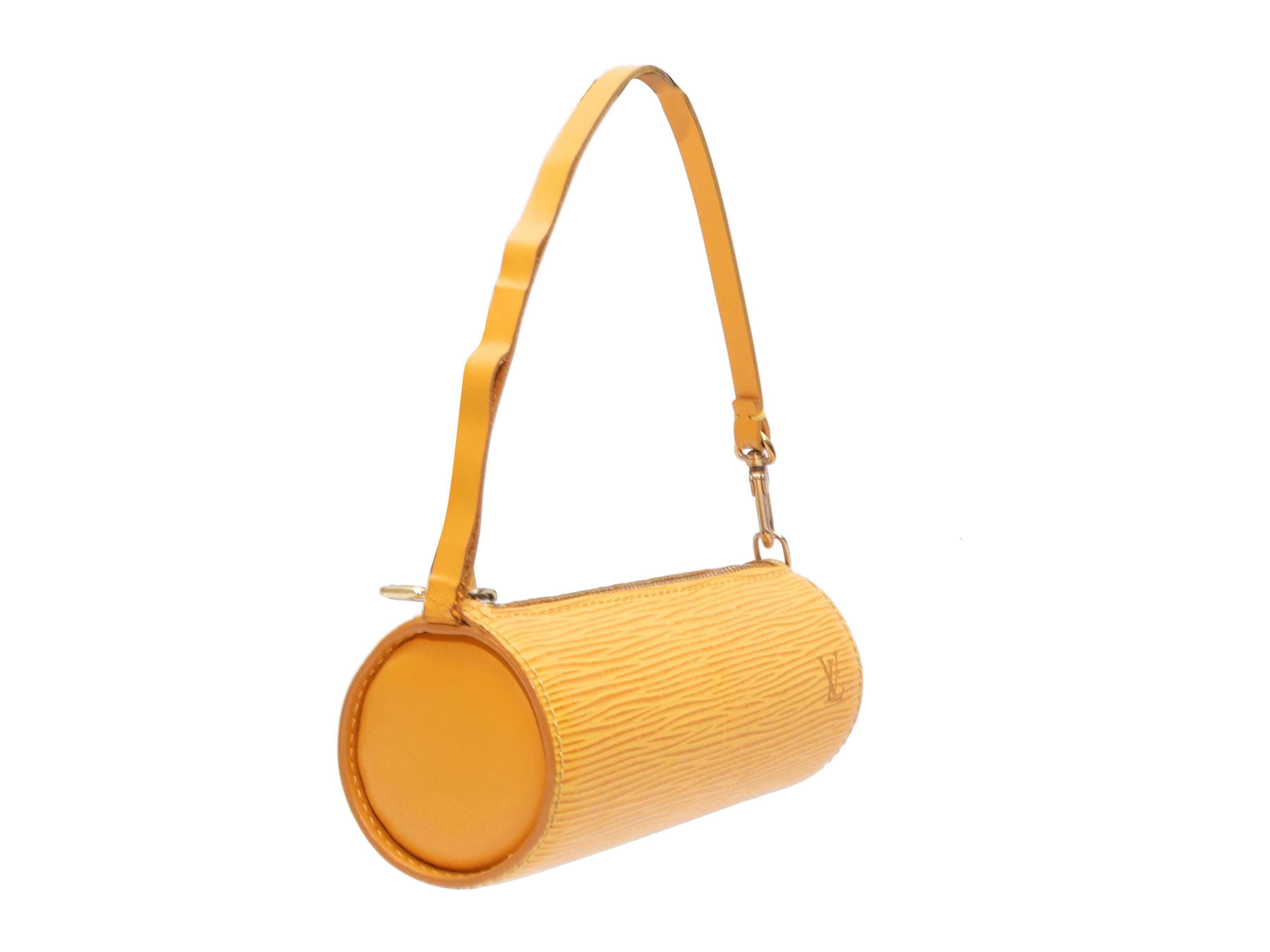 Product Details: Yellow epi leather Soufflot pouch by Louis Vuitton. Gold-tone hardware. Single shoulder strap. Top zip closure. 2.5