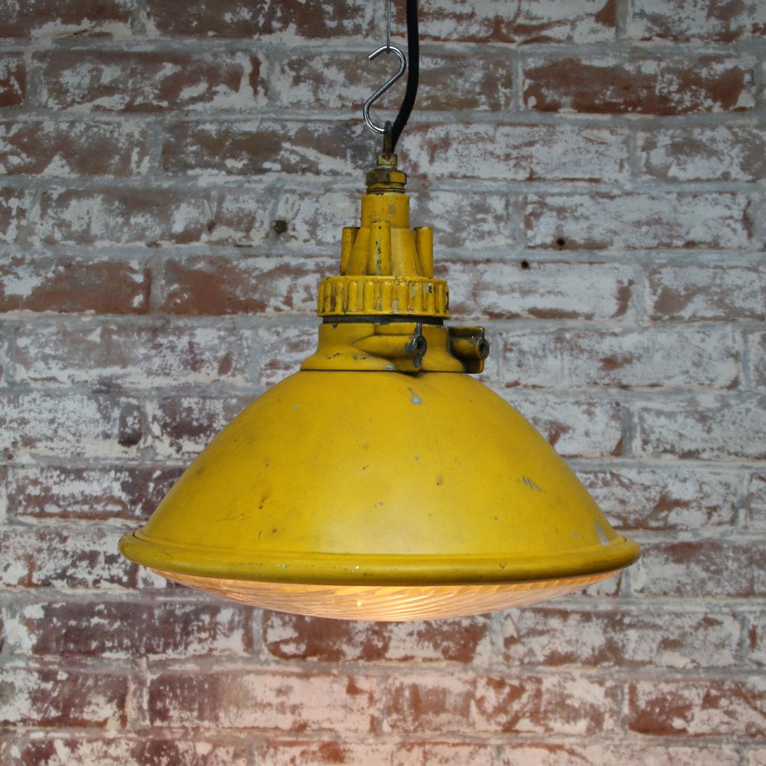 yellow metal pendant light