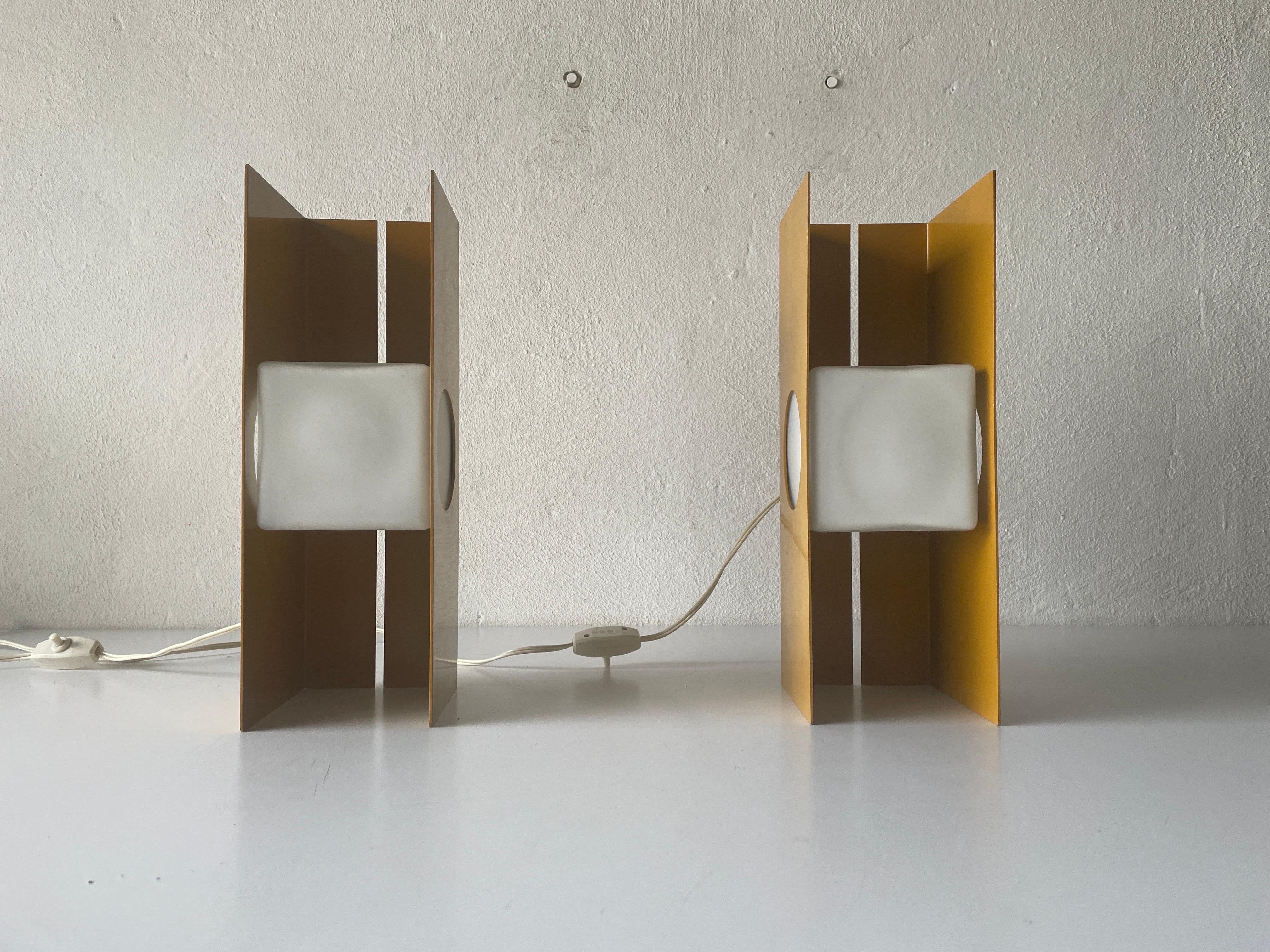 Yellow Metal Cube Glass Space Age Pair of Table Lamps by Luci, 1970s, Italy

Lampshade is in very good vintage condition.

It has European plug. It can be converted to other countries plugs with using converter. Also it can be rewired different type