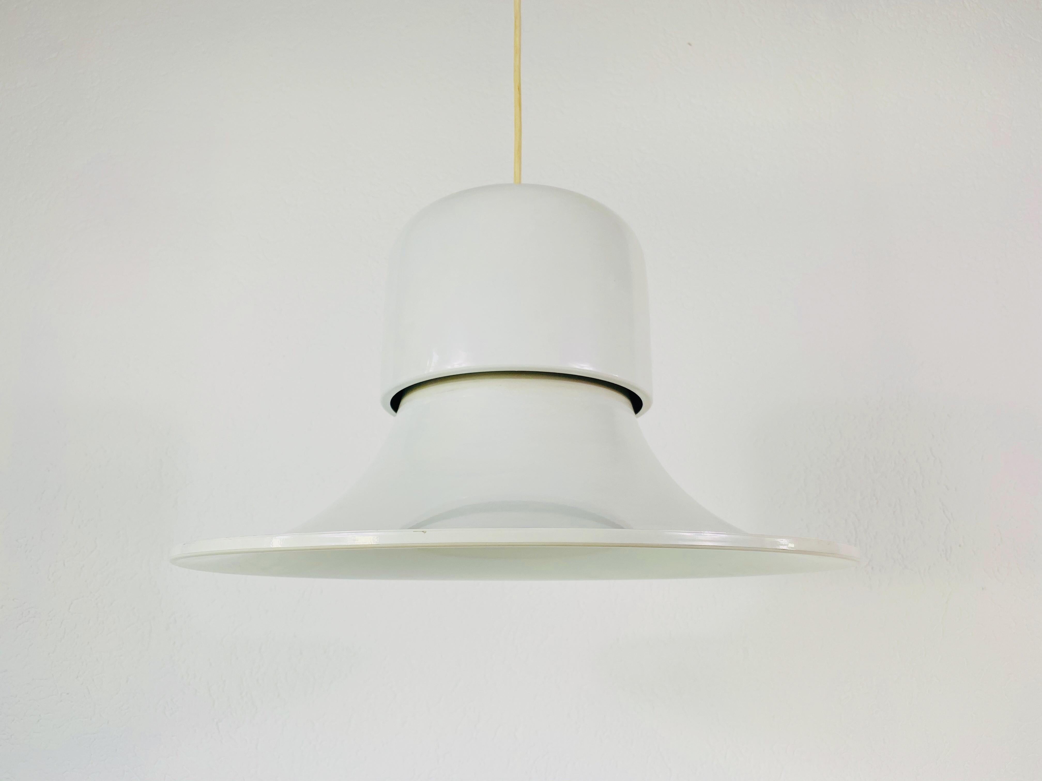 White pendant lamp in the style of Stilnovo made in Italy in the 1950s. The light has the shape of a witches has. It is made from thin aluminum and gives a beautiful light.

The light requires one E27 light bulb.
   