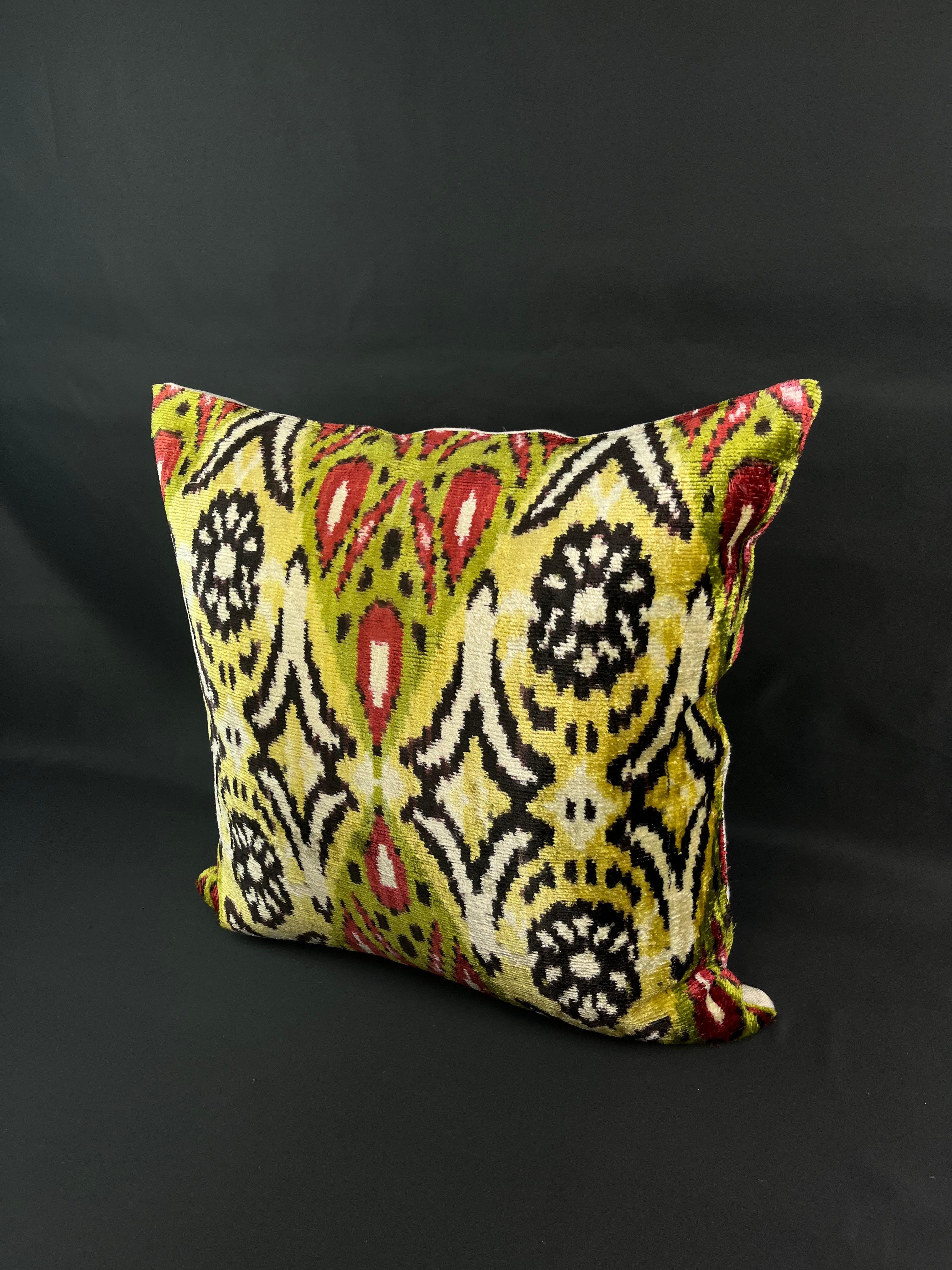 Introducing a stunning Turkish velvet ikat pillowcase, expertly handwoven from the finest silk and adorned with vibrant hand-dyed patterns. This exquisite pillowcase is a true work of art, crafted by skilled artisans using traditional techniques