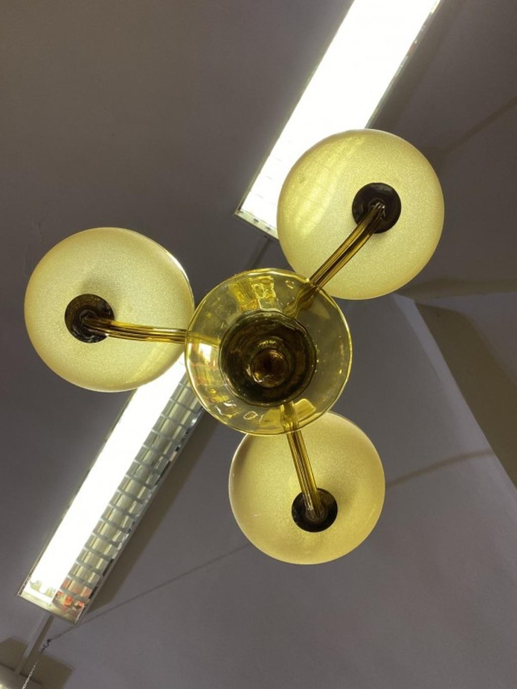 Yellow Murano chandelier in good original condition, one edge on lower glass bowl.