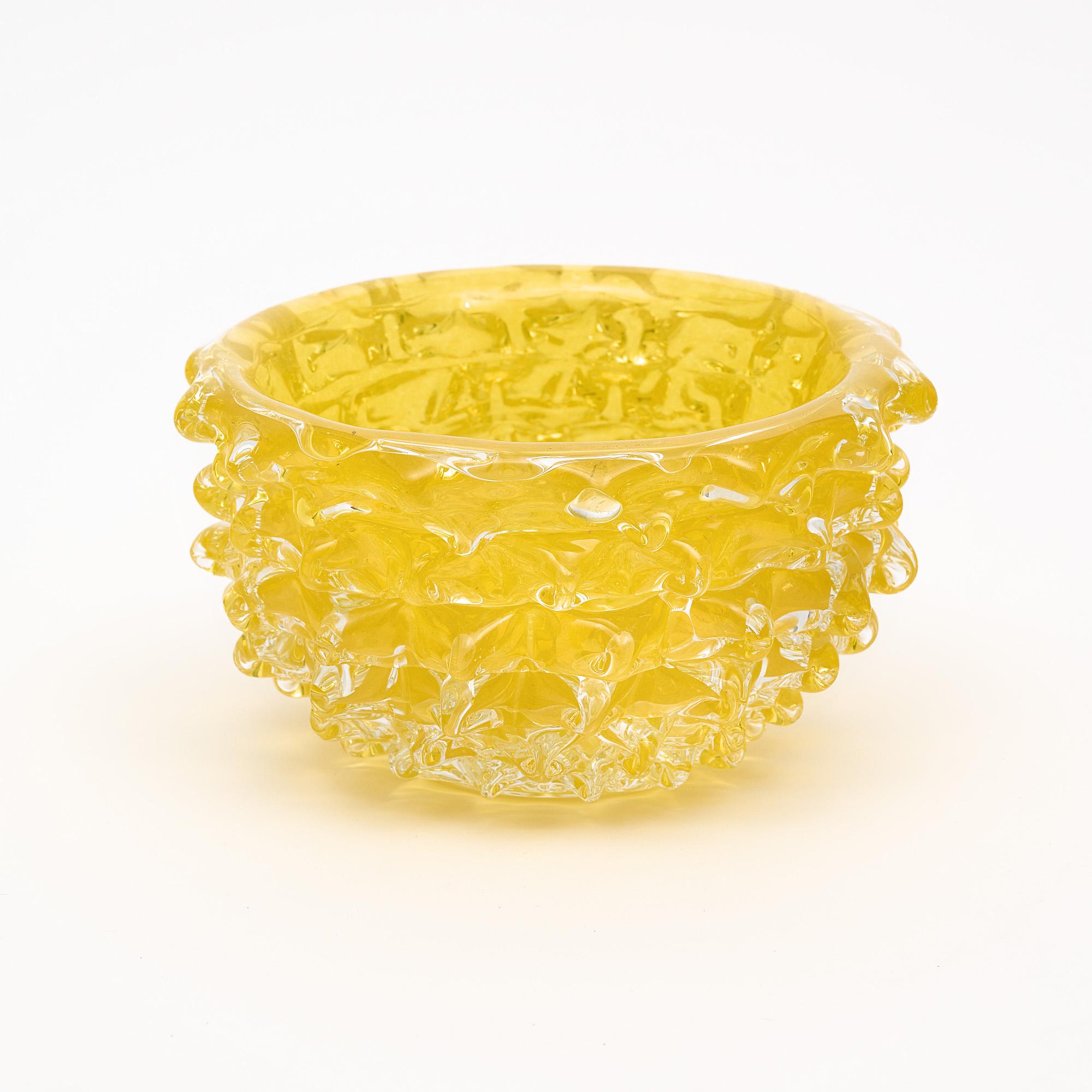 Murano glass bowl, Italian, from the island of Murano. This hand-blown piece has a striking yellow color and is made with the rostrate technique.
