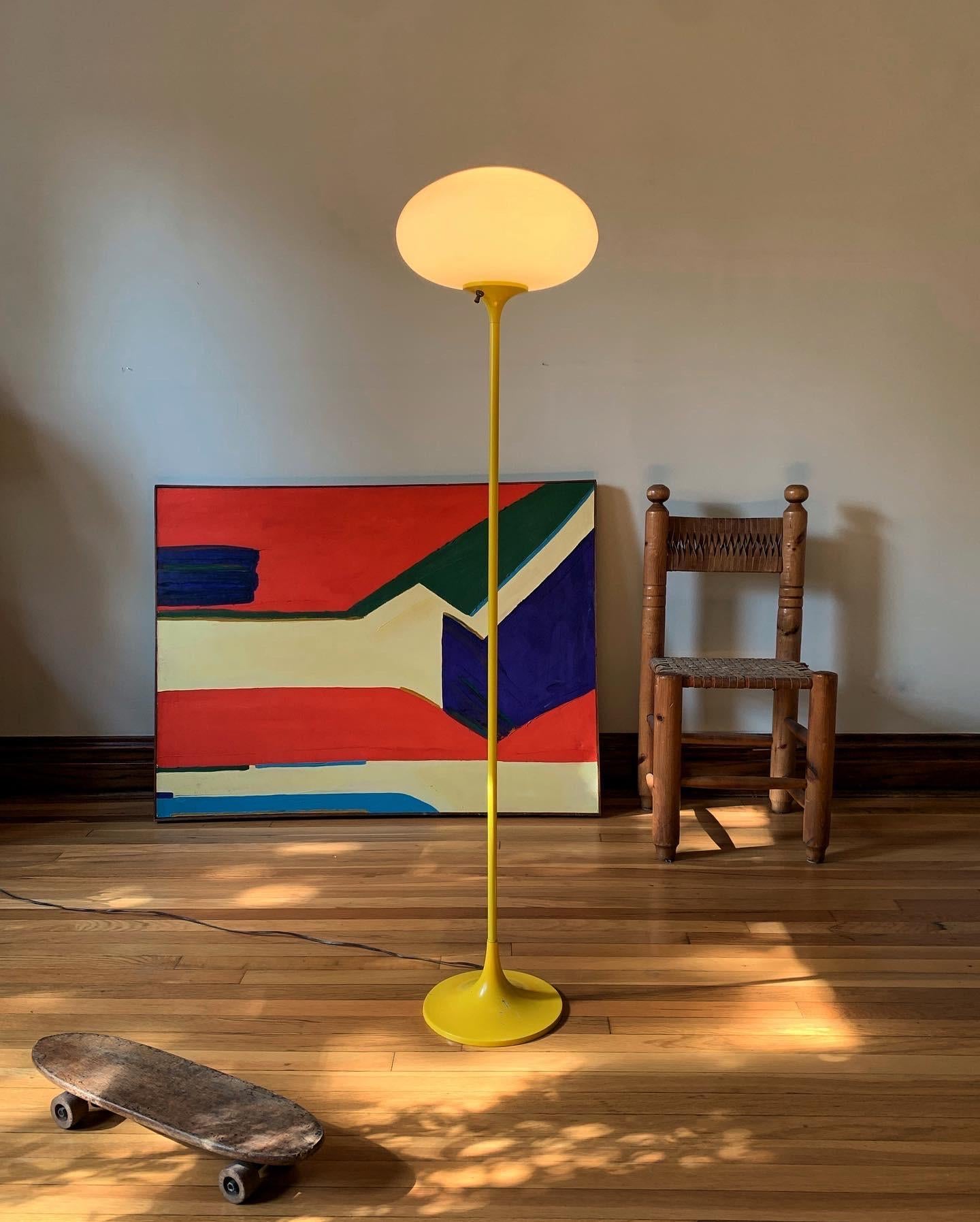 Equal parts elegantly modern and tastefully whimsical comes a rare offering from American lighting manufacturer Laurel Lamp Co, attributed to designer Bill Curry. Featuring their iconic glass shade, and the equally recognizable mushroom shaped base