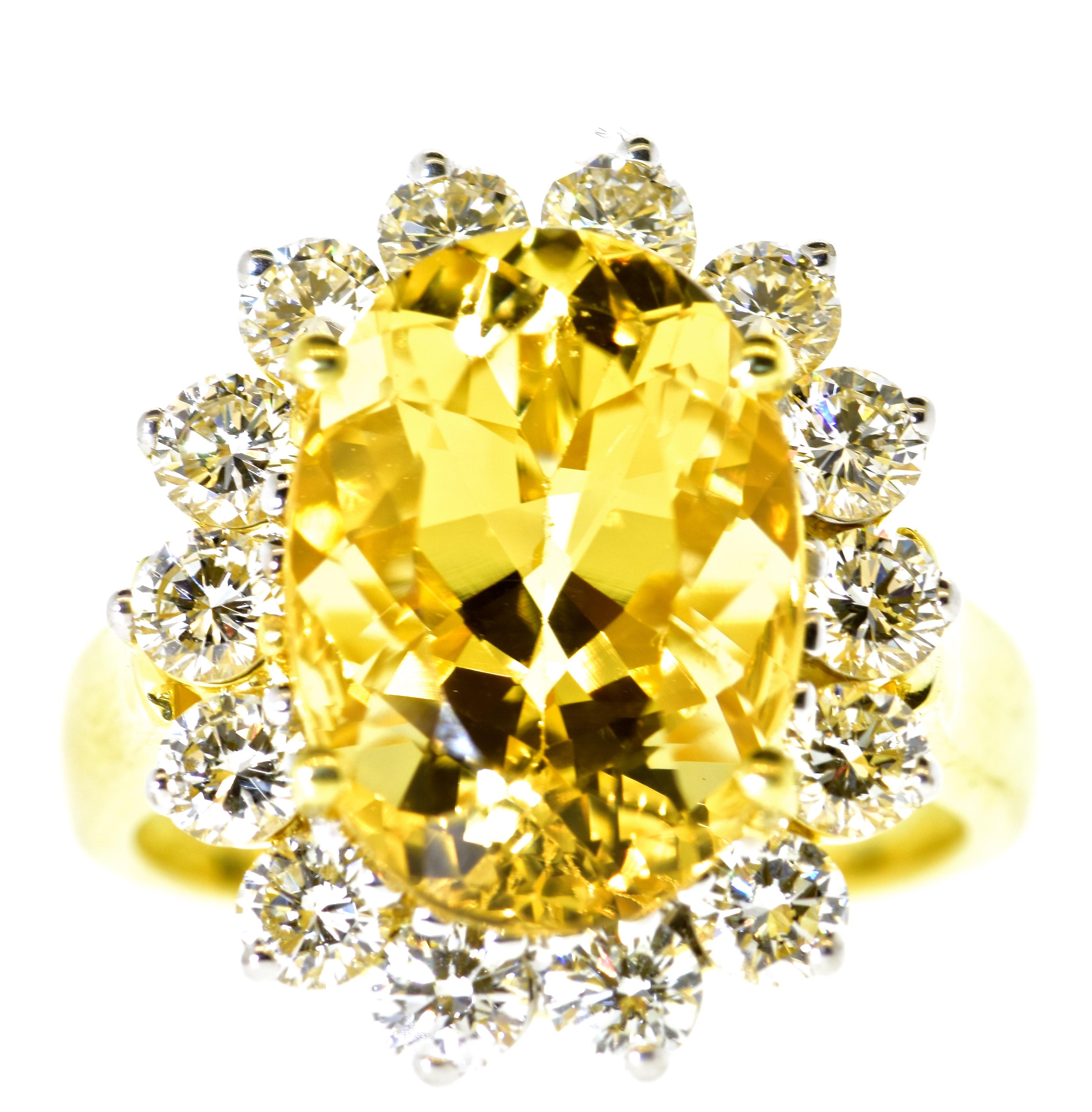 Diamond and Yellow sapphire possessing a fine bright pleasing yellow color is prong set in this 18K contemporary gold ring.  The  natural yellow sapphire weighs exactly 6.26 cts., and is surrounded by 14 fine white brilliant cut diamonds.  These