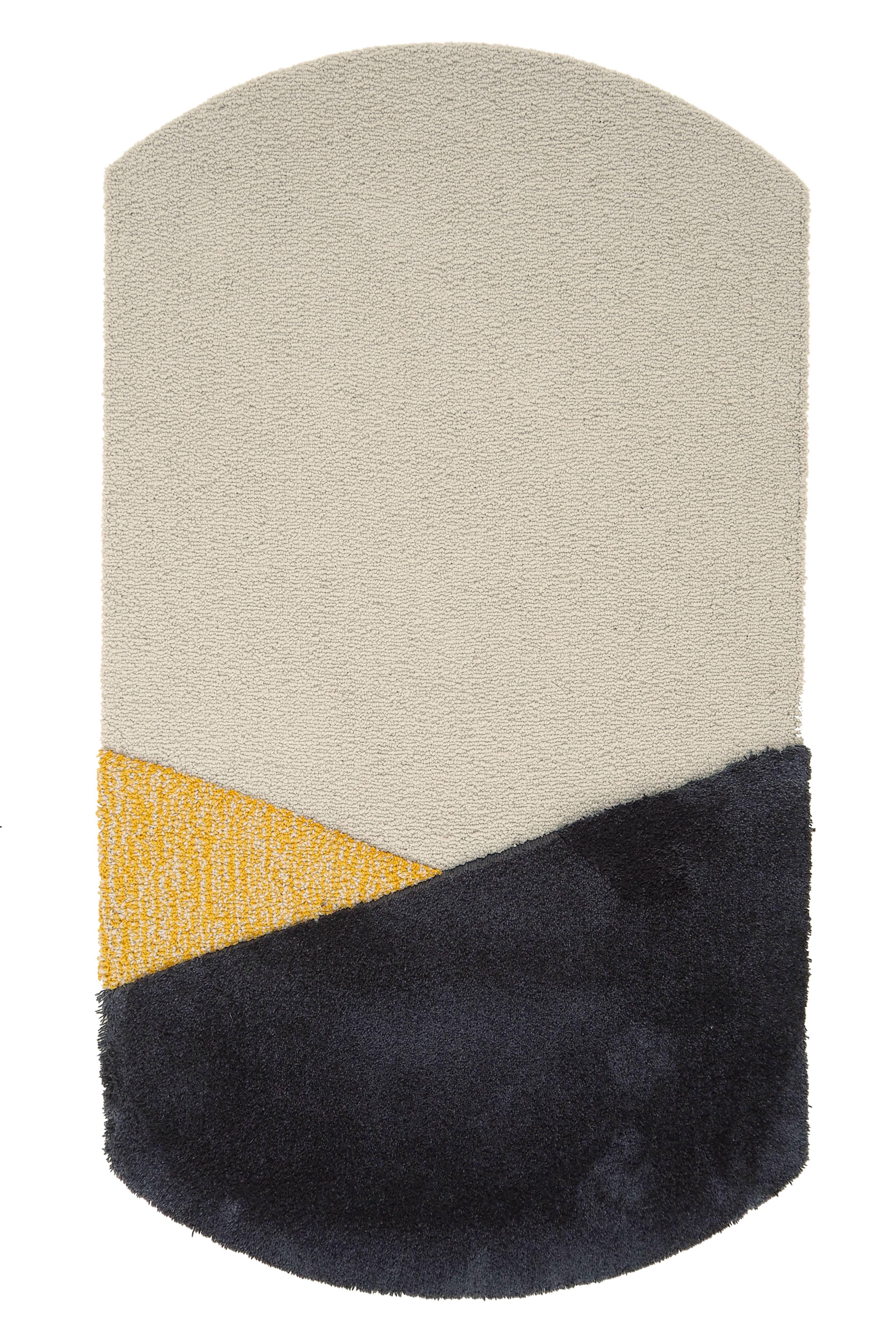 Yellow Oci Left Rug by Seraina Lareida
Dimensions: W 70 x H 130 cm 
Materials: 100% New Zeland top-quality wool.
Available in sizes Medium (110 x 200cm) and Large (150 x 280cm). Also available in colors: Brick/Pink, Yellow/Gray, Green/Brick,