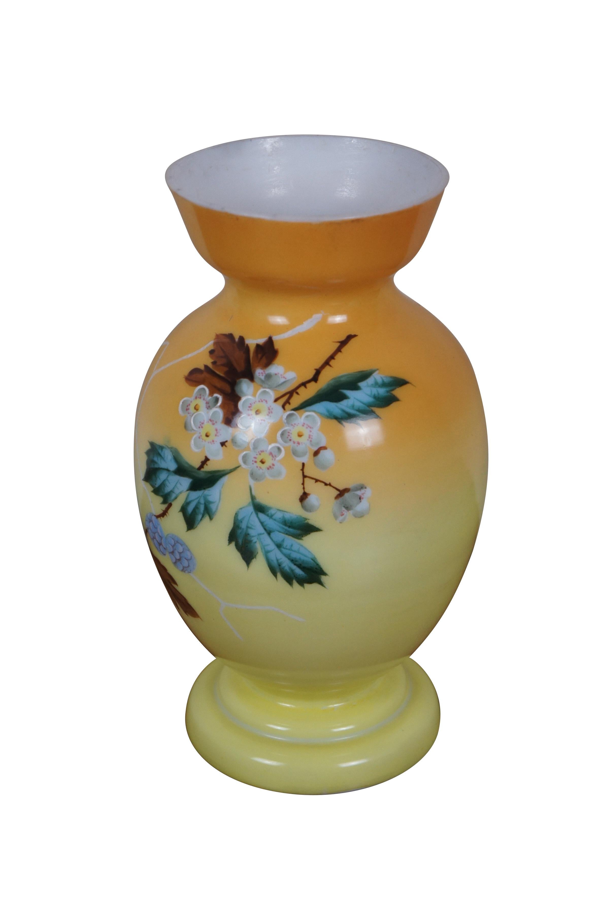 Vintage opaline / painted milk glass vase. Yellow and orange ombre with a hand painted design of crossed branches of cherry blossoms and pine cones. Marked 4 on base.

Dimensions:
6.5