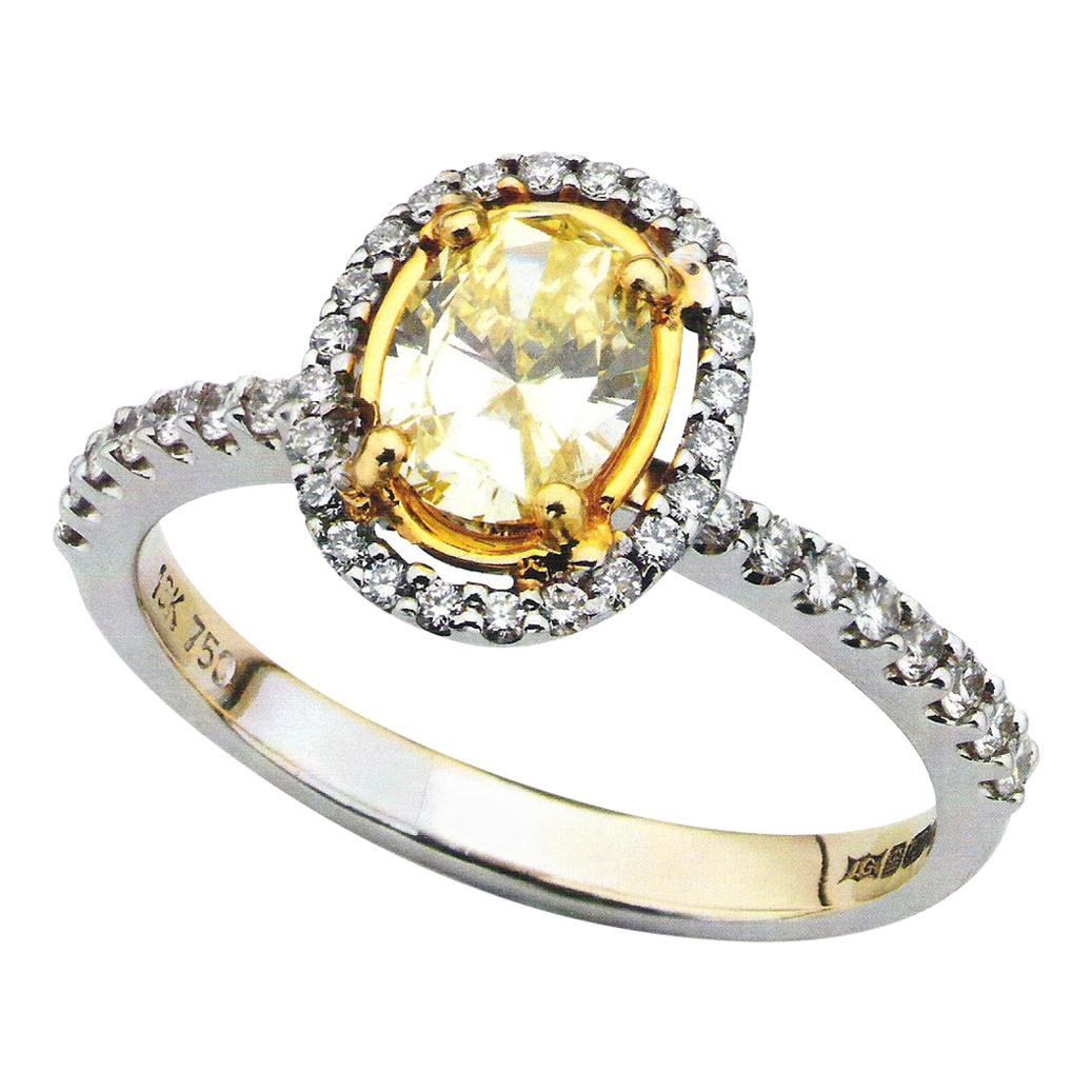 Yellow Oval 0.63 Carat Diamond White Gold Halo Engagement Ring For Sale