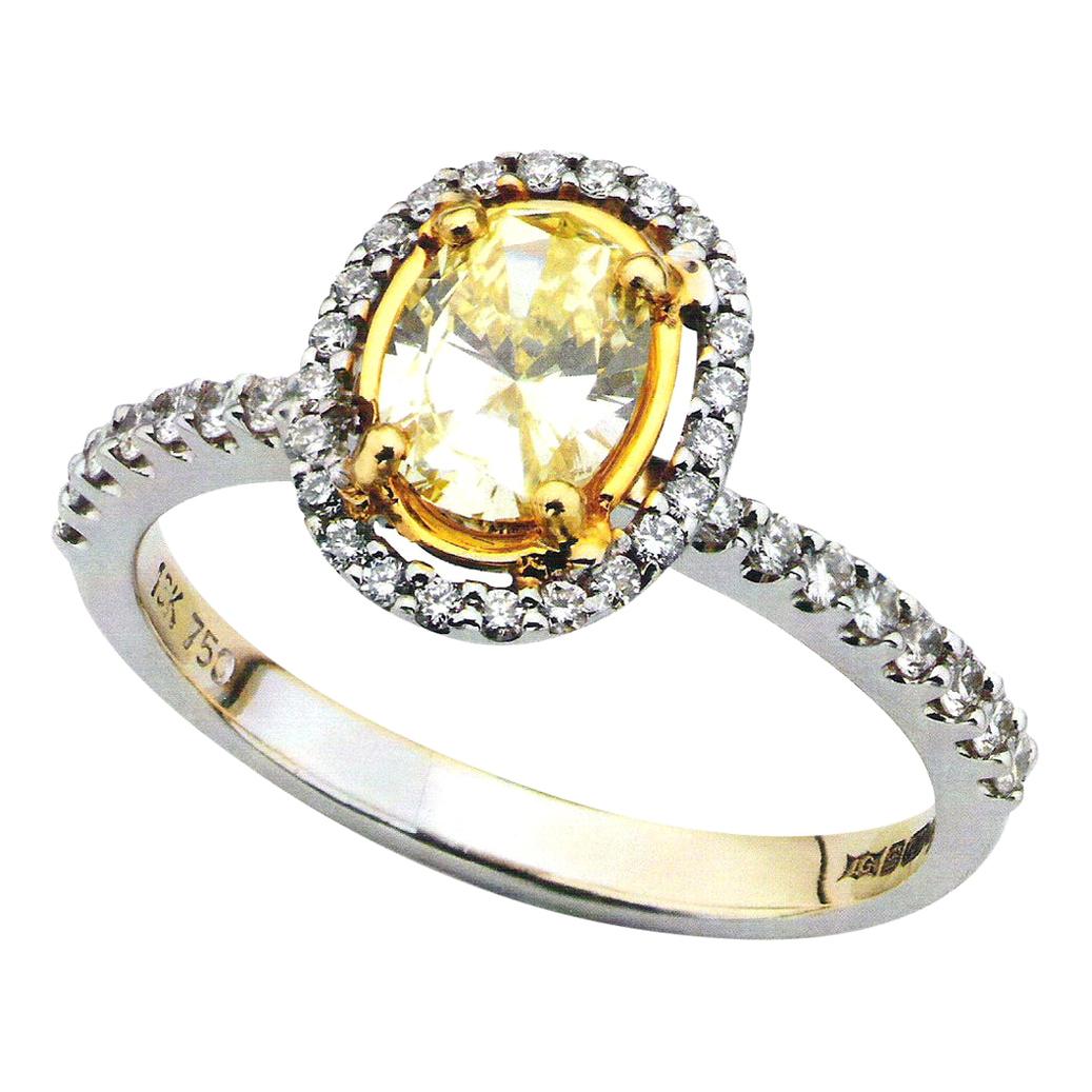 Yellow Oval 0.63 Carat Diamond White Gold Halo Engagement Ring For Sale