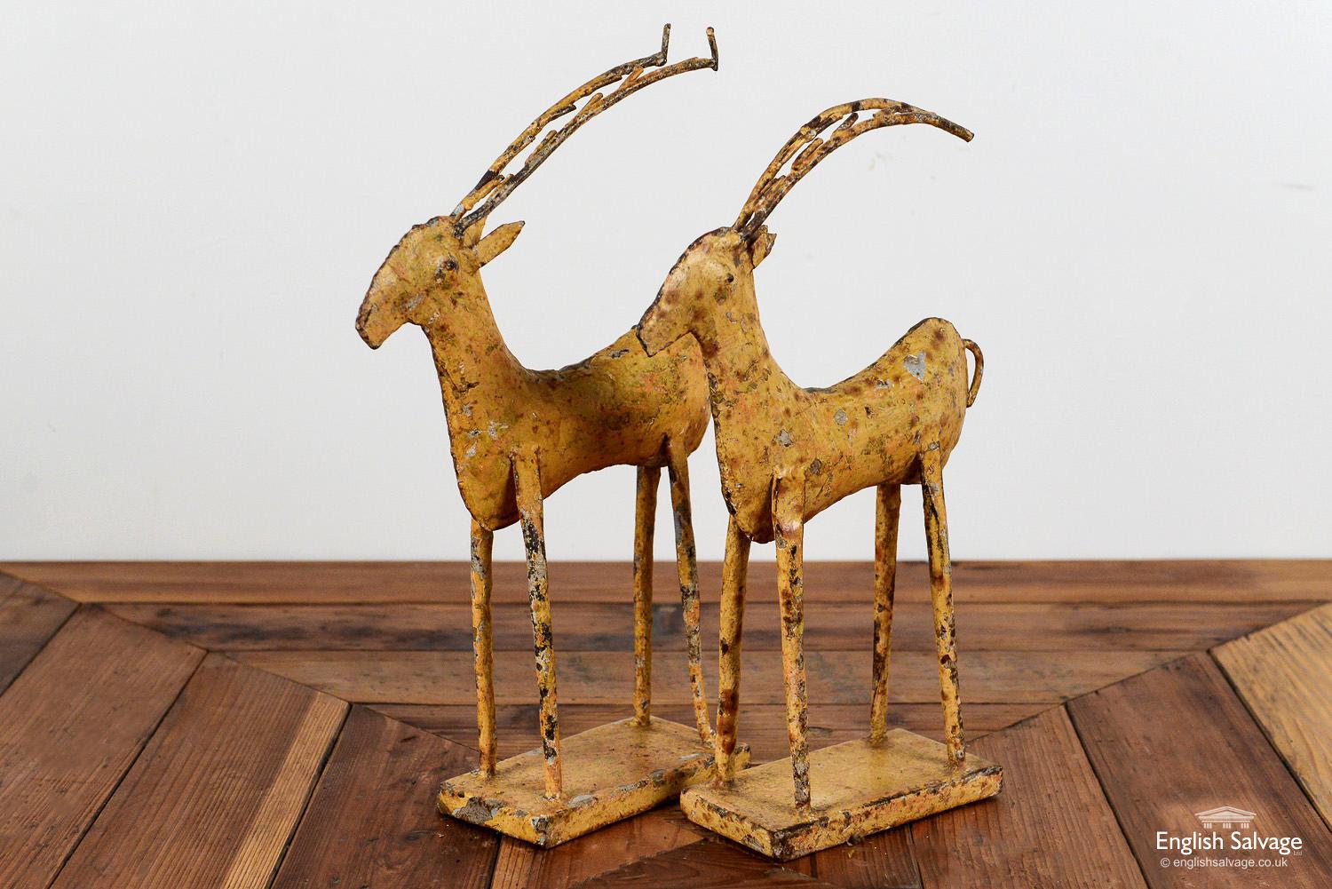 Quirky iron deer on rectangular bases in a simplistic, naïve style. Approximate size of each below. The paint finish is worn to both commensurate with age.