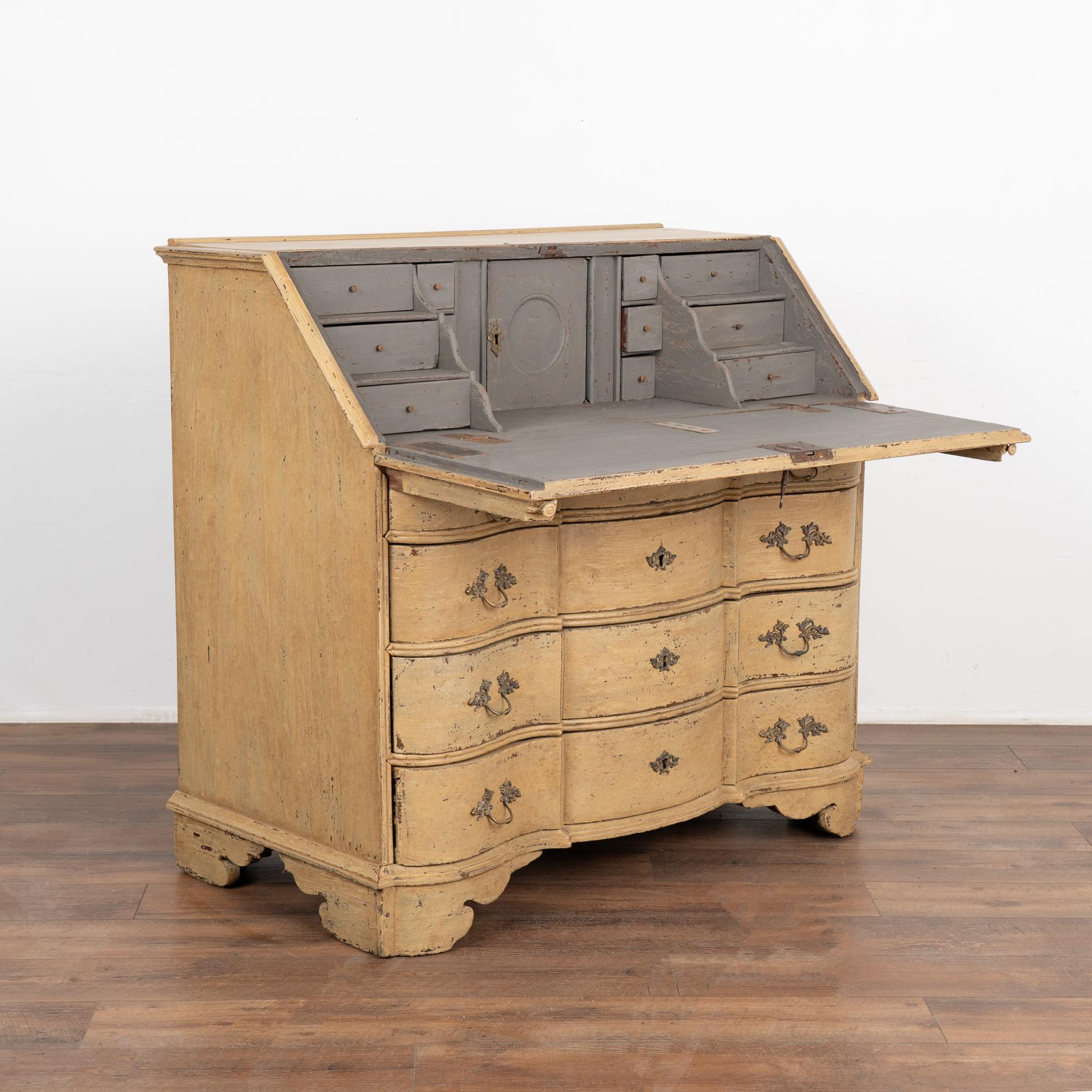 This oak secretary reflects the grace and class of European styling in the early 1800's with four serpentine drawers and curved skirt.
The traditional interior with 12 small drawers and central storage area offers the perfect space to organize.
This