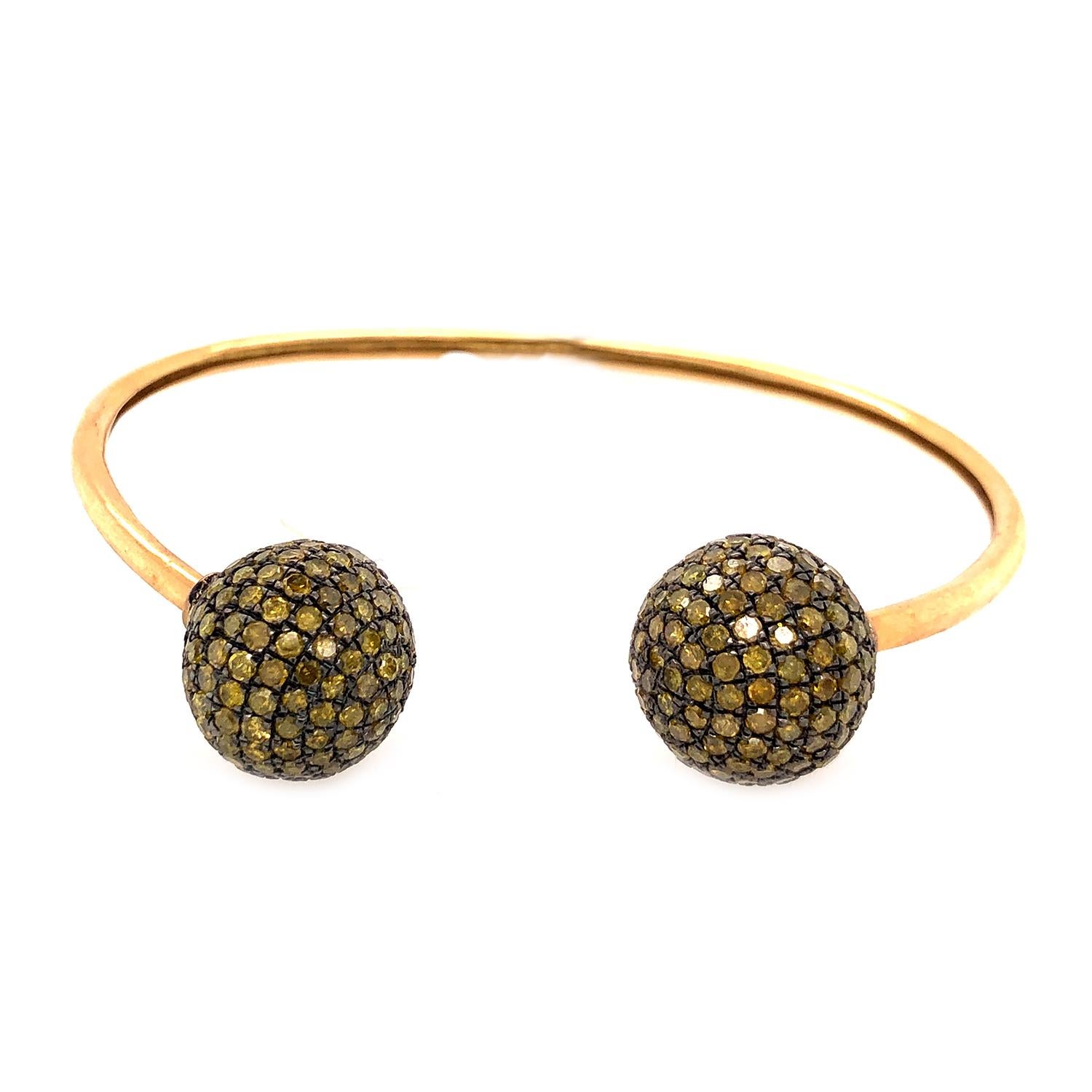 gold bangle with balls on end