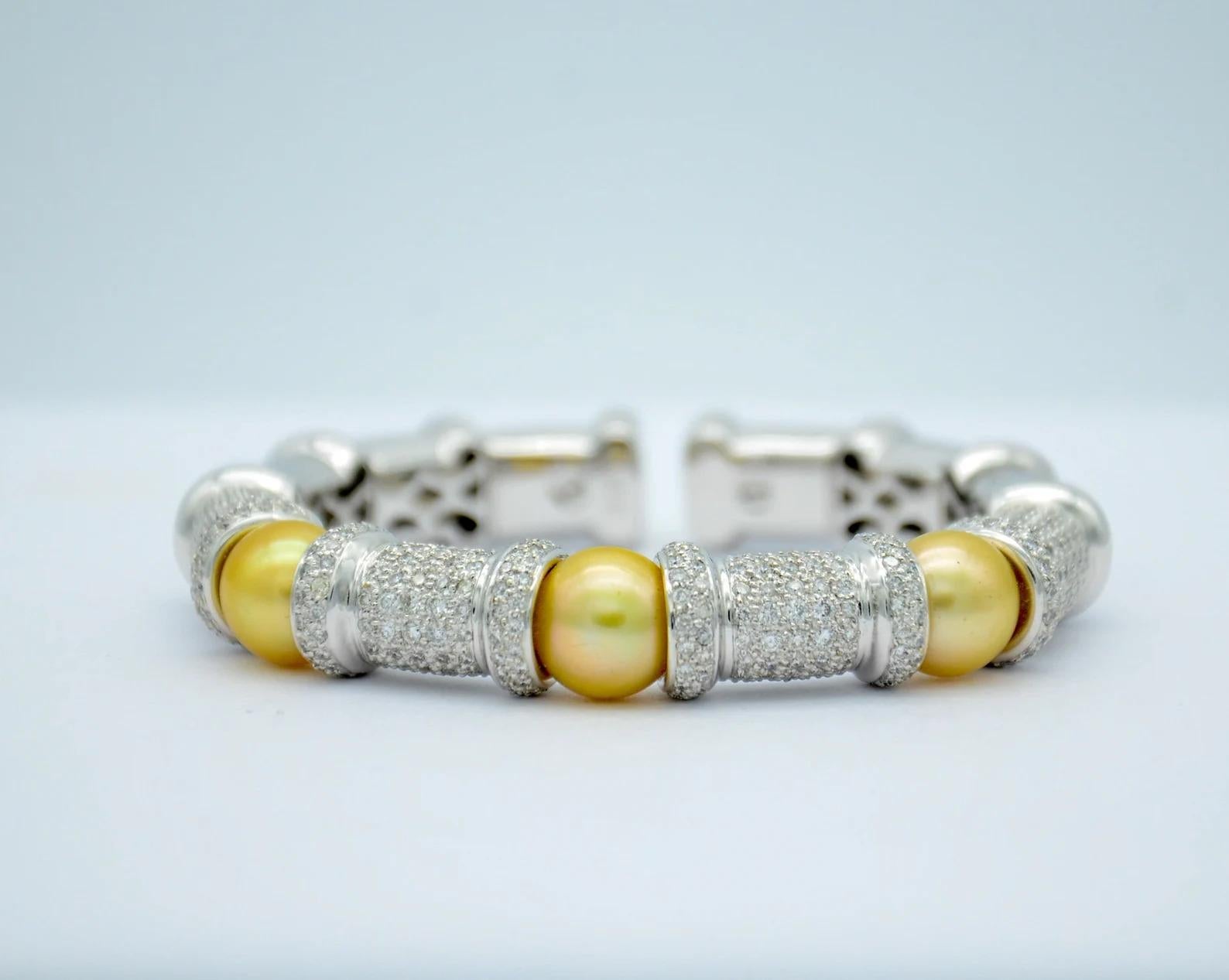 This beautiful bangle flexes to fit over your hand and onto your wrist. This unique bracelet is made from yellow pearls and white gold for a subtle, elegant look. This is perfect for ladies seeking essentials to build their jewelry collection.

18K