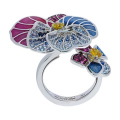 Bague violette en or blanc 18 carats avec saphirs jaunes, roses, bleus et rubis