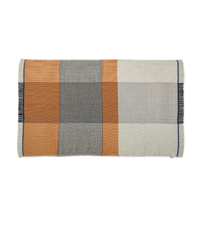 Yellow plaid ruana by Sebastian Herkner
Materials: 100% natural virgin wool. 
Technique: Hand-woven in Colombia. 
Dimensions: W 200 x H 120 cm 
Available in colors: yellow/ grey/ blue, blue/ black/ yellow, ochre/ green/ rose.

The Ruana