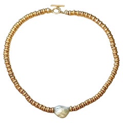 Yellow Plaked Gold Silver Necklace Adorned With A Rough Pearl