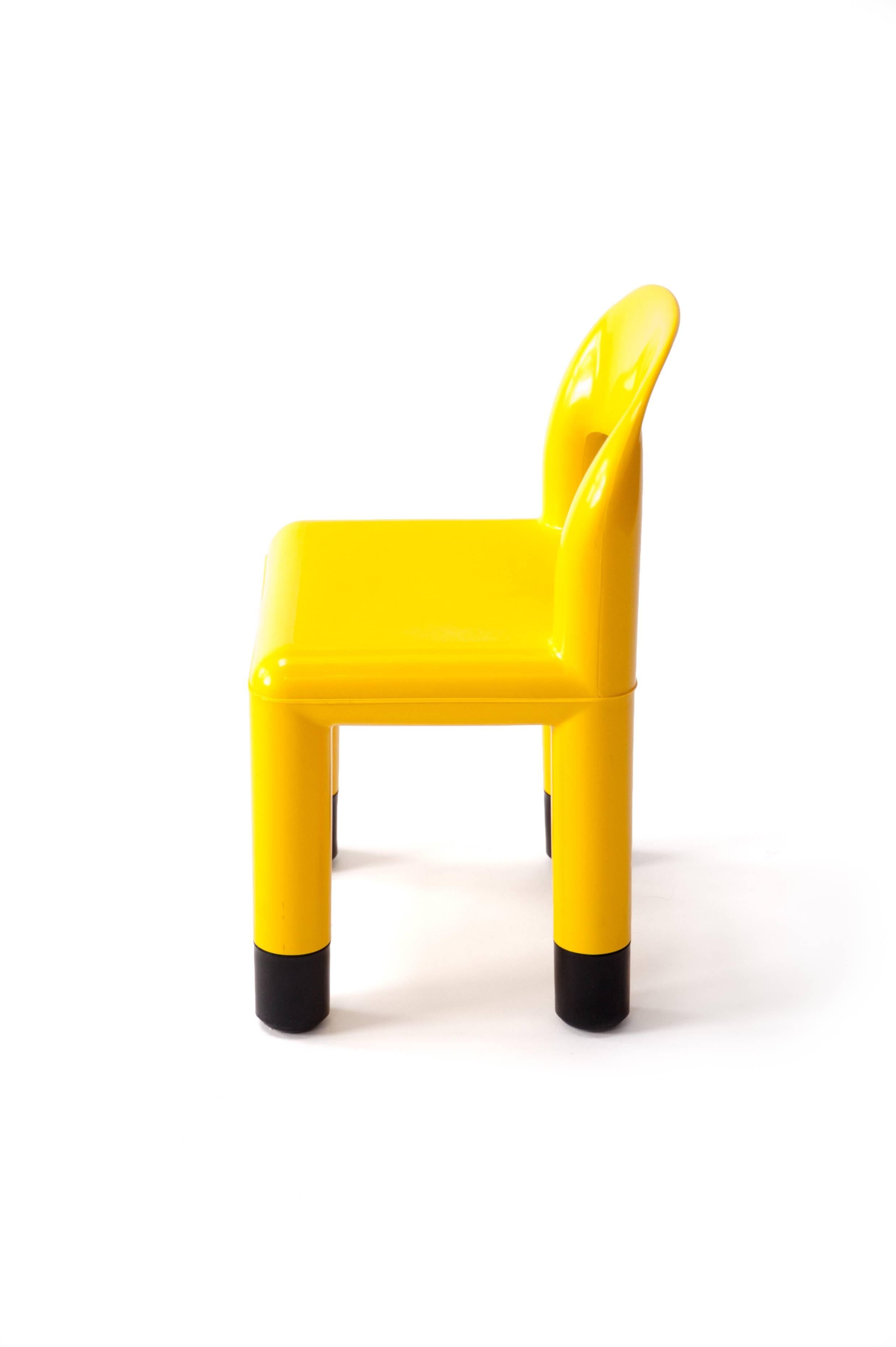 Yellow plastic child chair, vintage, Italy, 1980s

Vintage, Italy, 1980s
Yellow molded plastic with black plastic leg caps
Marked 