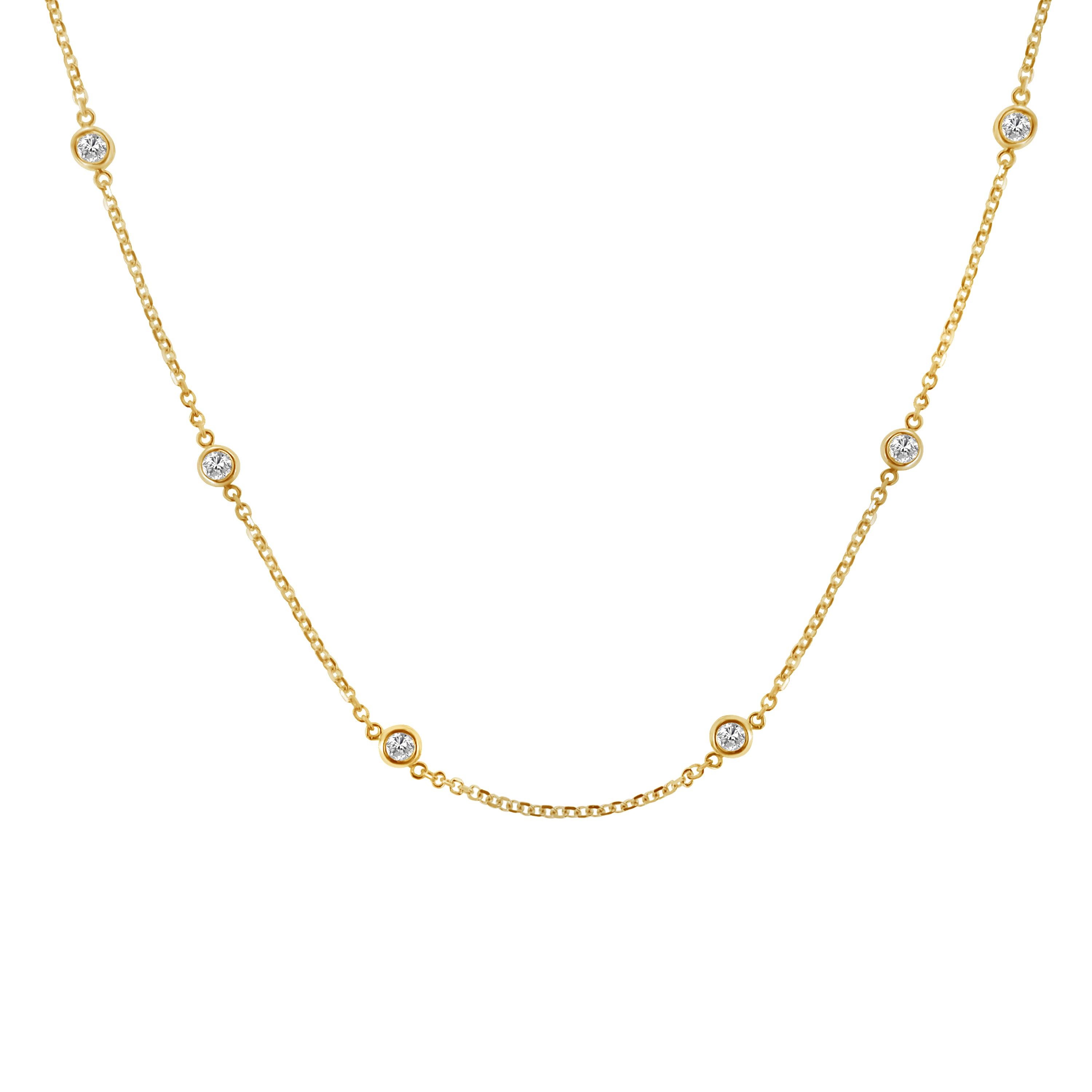 A great complement to both dressy and casual wear, this sterling silver, diamond station necklace, in your choice of white, yellow, and rose colors is extremely trendy, classy, and fashionable. Twelve brilliant cut round diamonds, weighing 1 carat