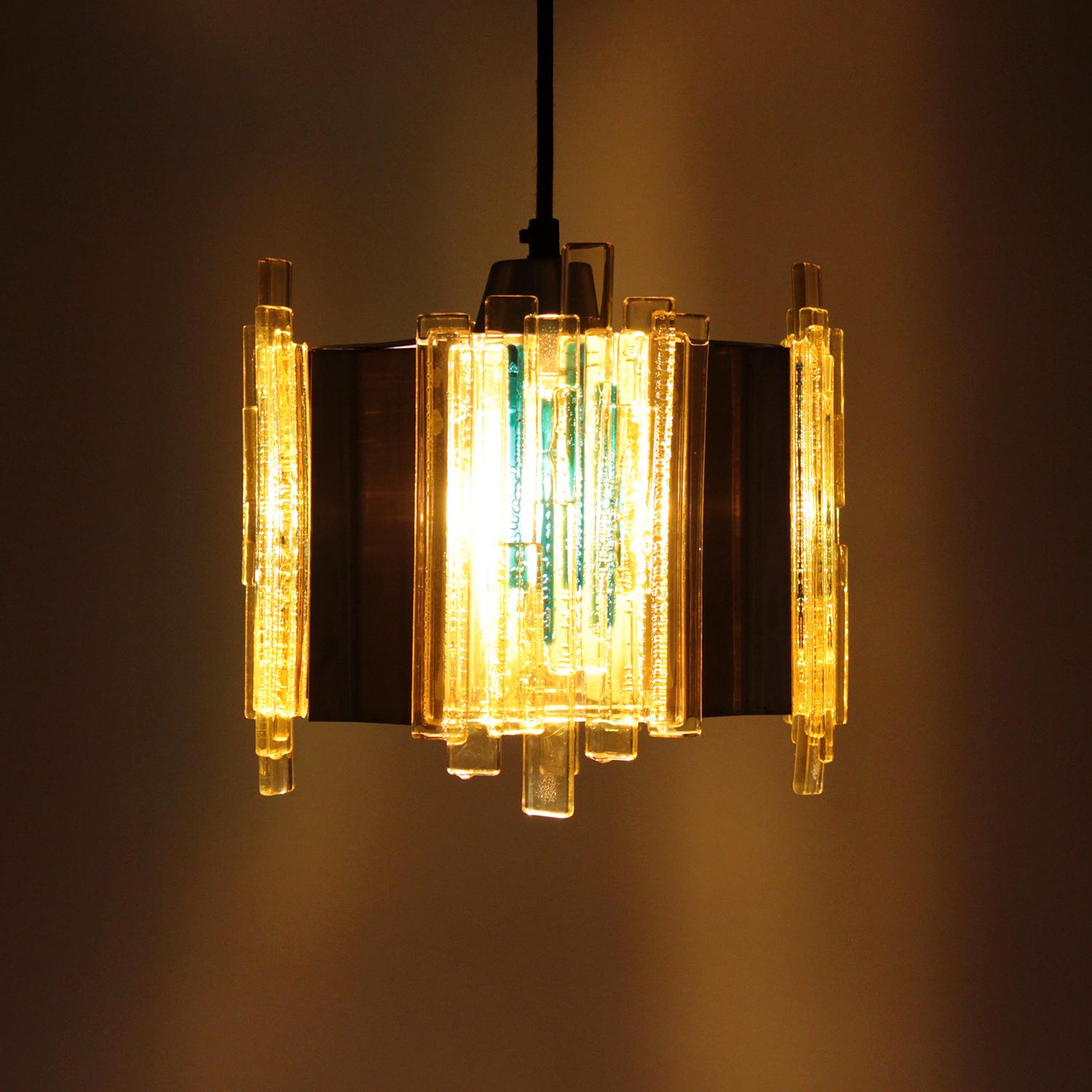 Yellow plexiglas pendant by Claus Bolby in 1970s and produced by CEBO Industri - beautiful sunny yellow Plexiglas and brass lacquered hanging lamp.

An octagon shaped metal pendant with four brass lacquered concave sides and four straight sides,