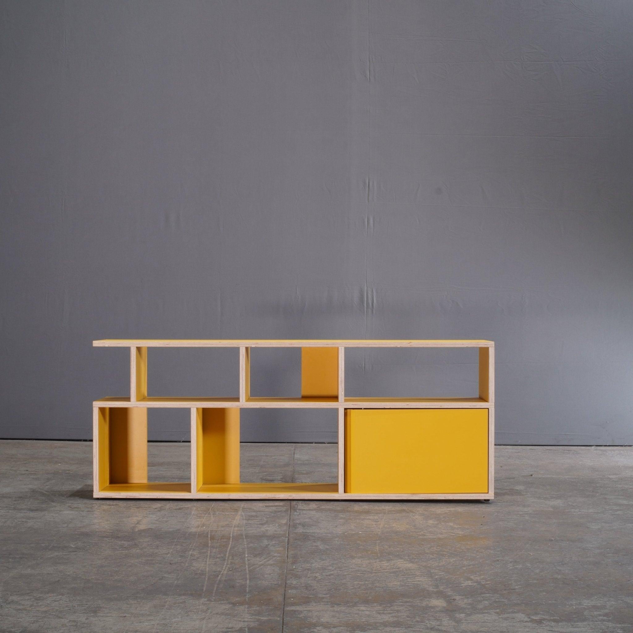 Introducing the Yellow Plywood Sideboard by Tylko – a stunning blend of form and function that effortlessly elevates any contemporary interior. Crafted with precision, this sideboard showcases a sleek plywood structure, accentuated by a vibrant