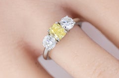 Yellow Radiant Cut Diamond and Round Diamond Three-Stone Platinum
