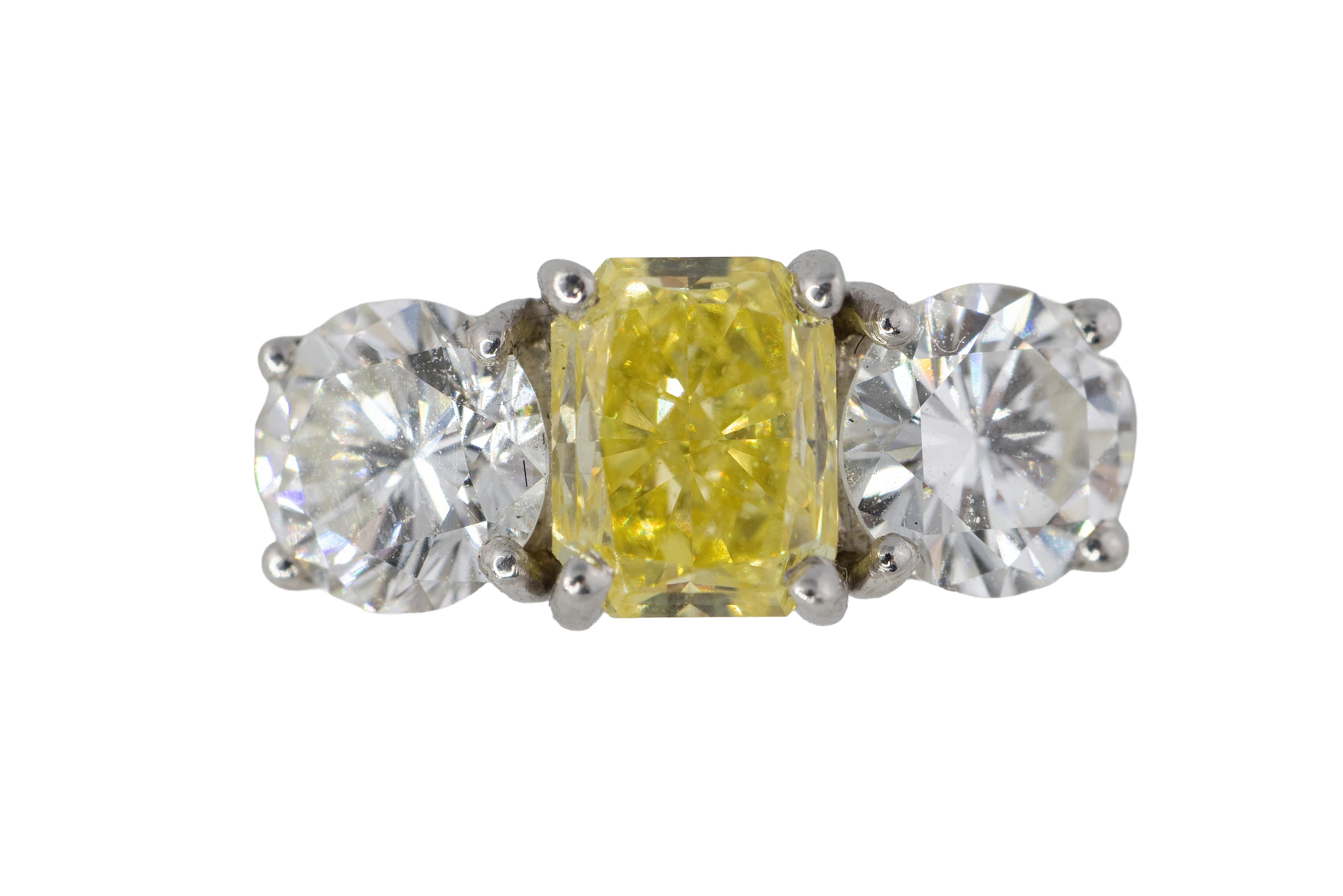 Yellow Radiant Cut Diamond and Round Diamond Three-Stone Platinum For Sale