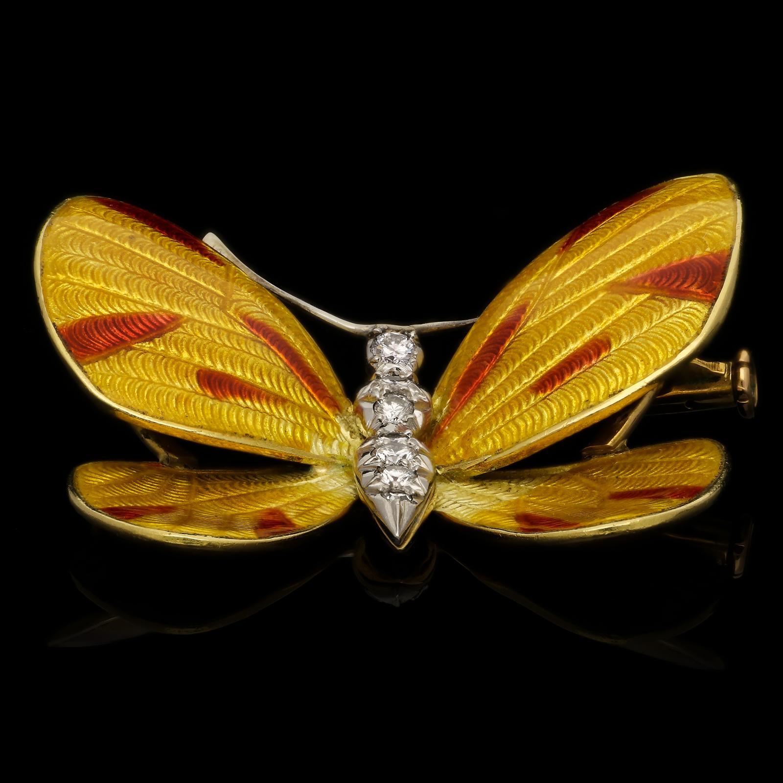 Description
A beautiful vintage enamel and diamond butterfly brooch by Boucheron c.1960s, of three dimensional form in 18ct yellow gold, the wings decorated with yellow and red basse-taille enamel and the body set with seven round brilliant cut