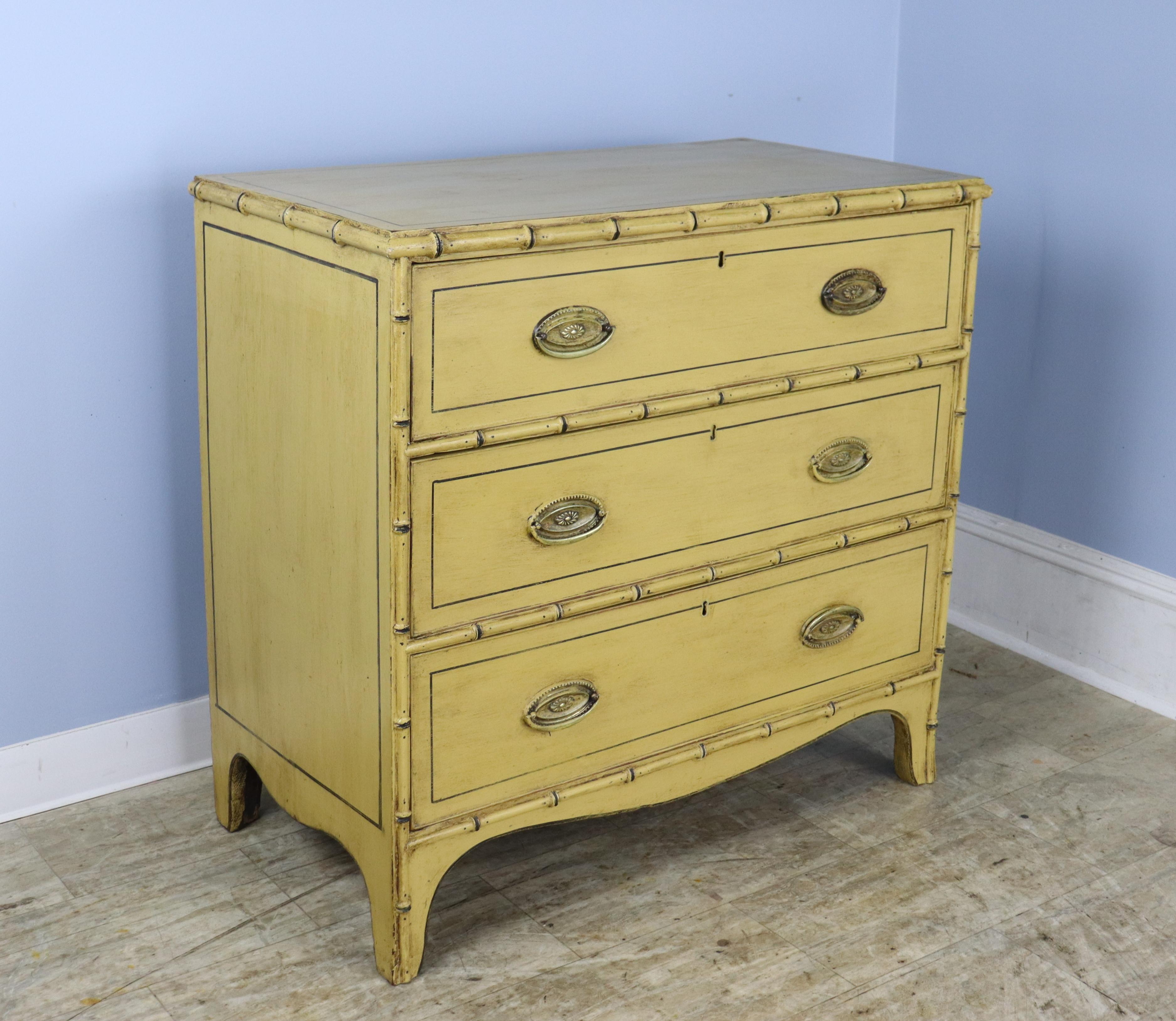 A charming Regency chest of drawers with bamboo detail, newly painted in an antique yellow/butterscotch, finished with beeswax to create a faux distressed effect. Perfectly suited to a beach cottage, child's room or guest room. Roomy drawers open