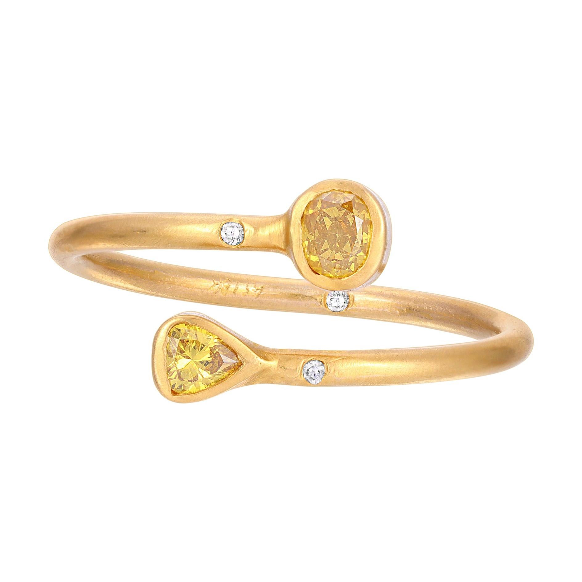 This .16ct Dainty Yellow Rose Cut Diamond wrap ring is bezel set with Diamond accents.  It is set in 18k Matte Finish Yellow Gold. The ring is a size 6 1/2 and was handmade in Los Angeles. All Diamonds are ethically sourced. 