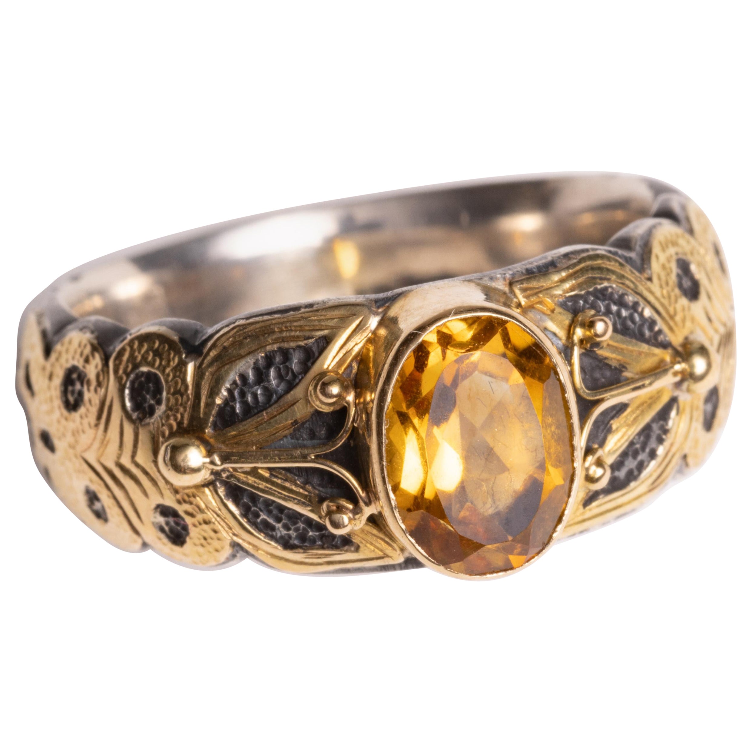 Anello con zaffiro giallo, oro 18 carati e argento sterling