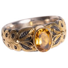 Anello con zaffiro giallo, oro 18 carati e argento sterling