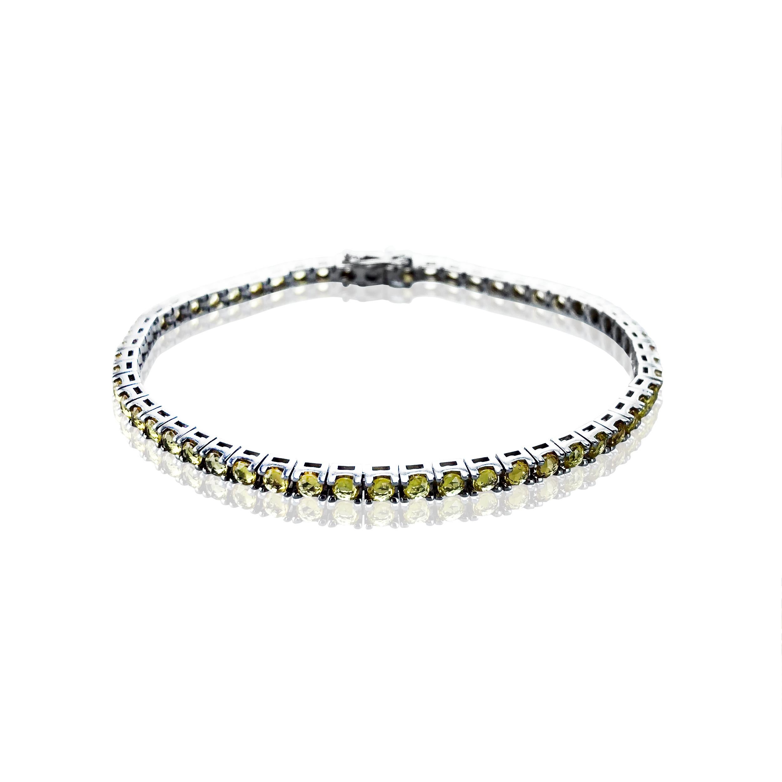 This gorgeous Yellow Sapphire 4.42 Carat tennis bracelet, is set in a TET designed 18Kt White Gold chain, making a striking statement on any wrist.  

Unisex it looks fabulous worn alone or stacked with other bracelets. 

Water proof it retains its