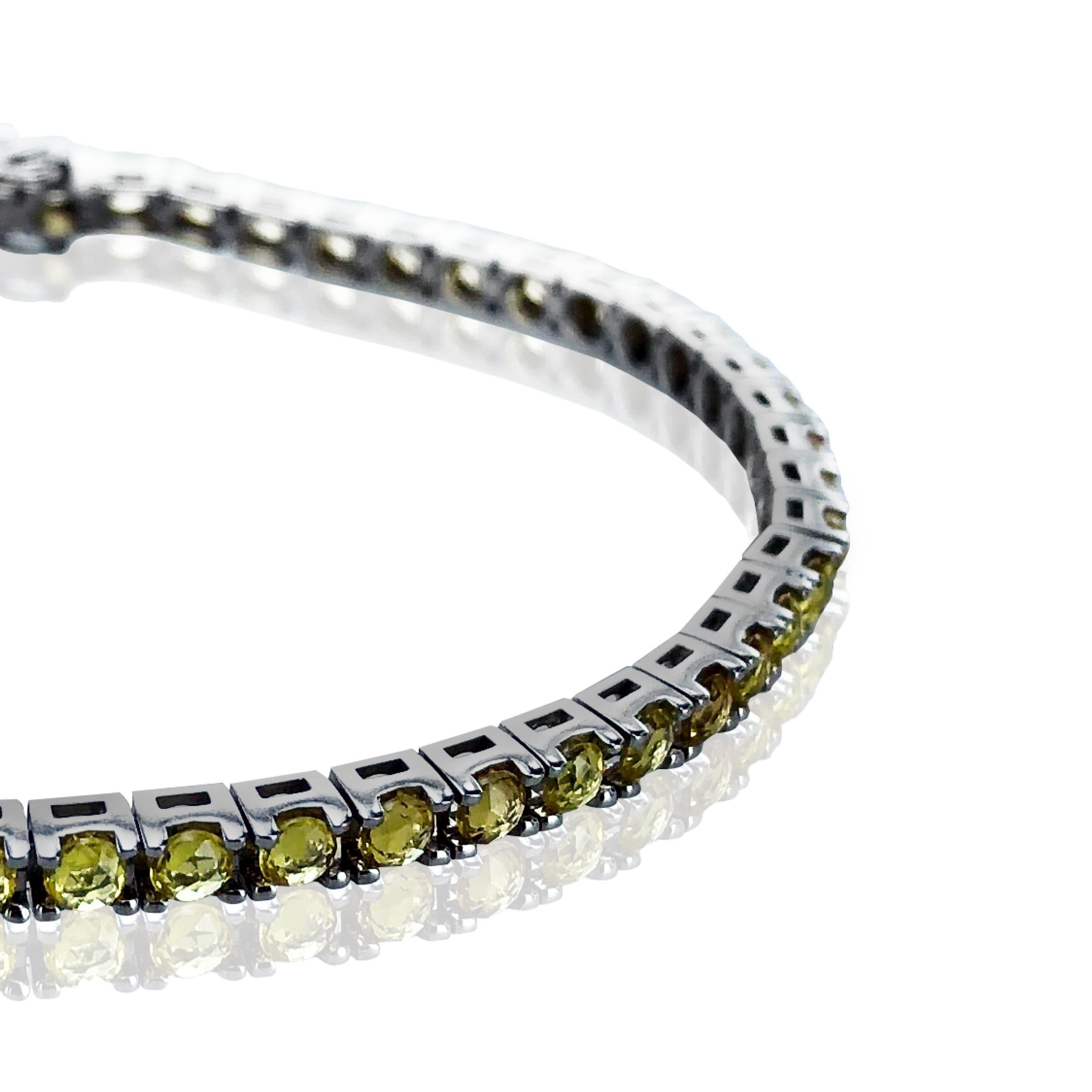 This gorgeous 4.77 Carat Yellow Sapphire tennis bracelet, set in a TET 18kt Black Gold bracelet makes a striking statement on any wrist.  

Unisex it looks fabulous on anyone, worn alone or stacked with other bracelets. 

Water proof it retains its