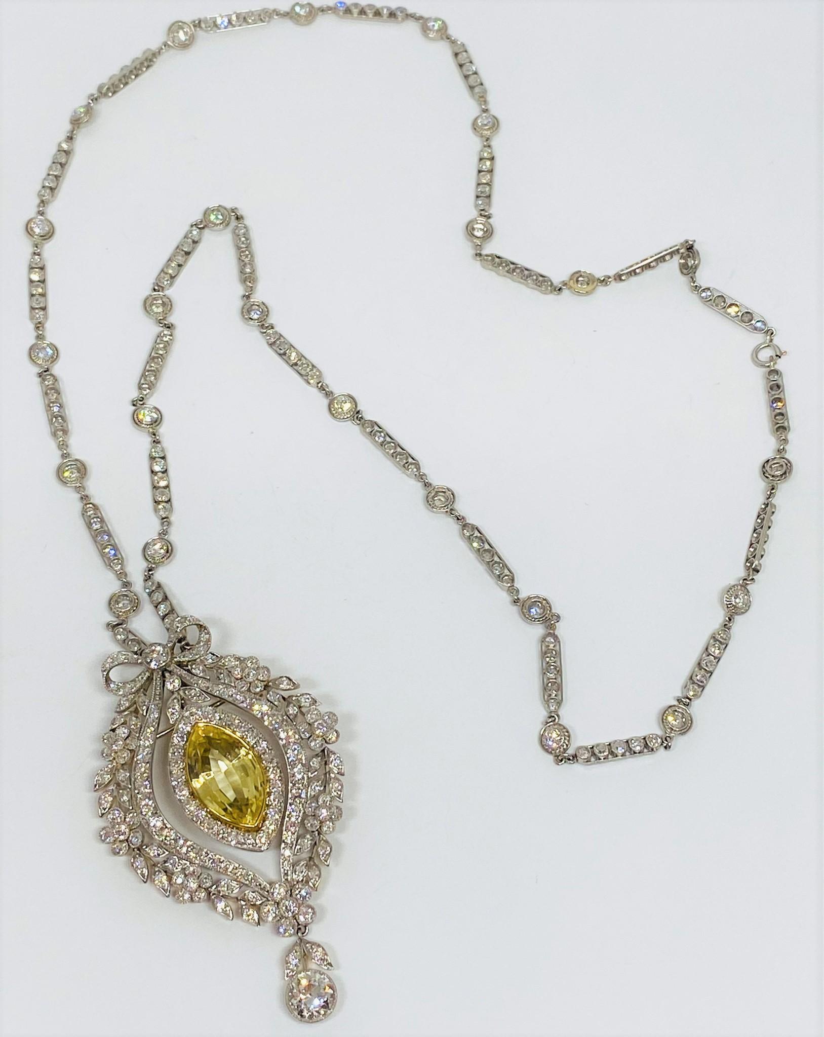 Incredible and rare estate necklace with a brooch pendant from the 1890's in platinum featuring a diamond bezel 22 inch chain in platinum with a beautiful ornate pendant, which can be removed and worn as a brooch with a C clasp closure, that holds a