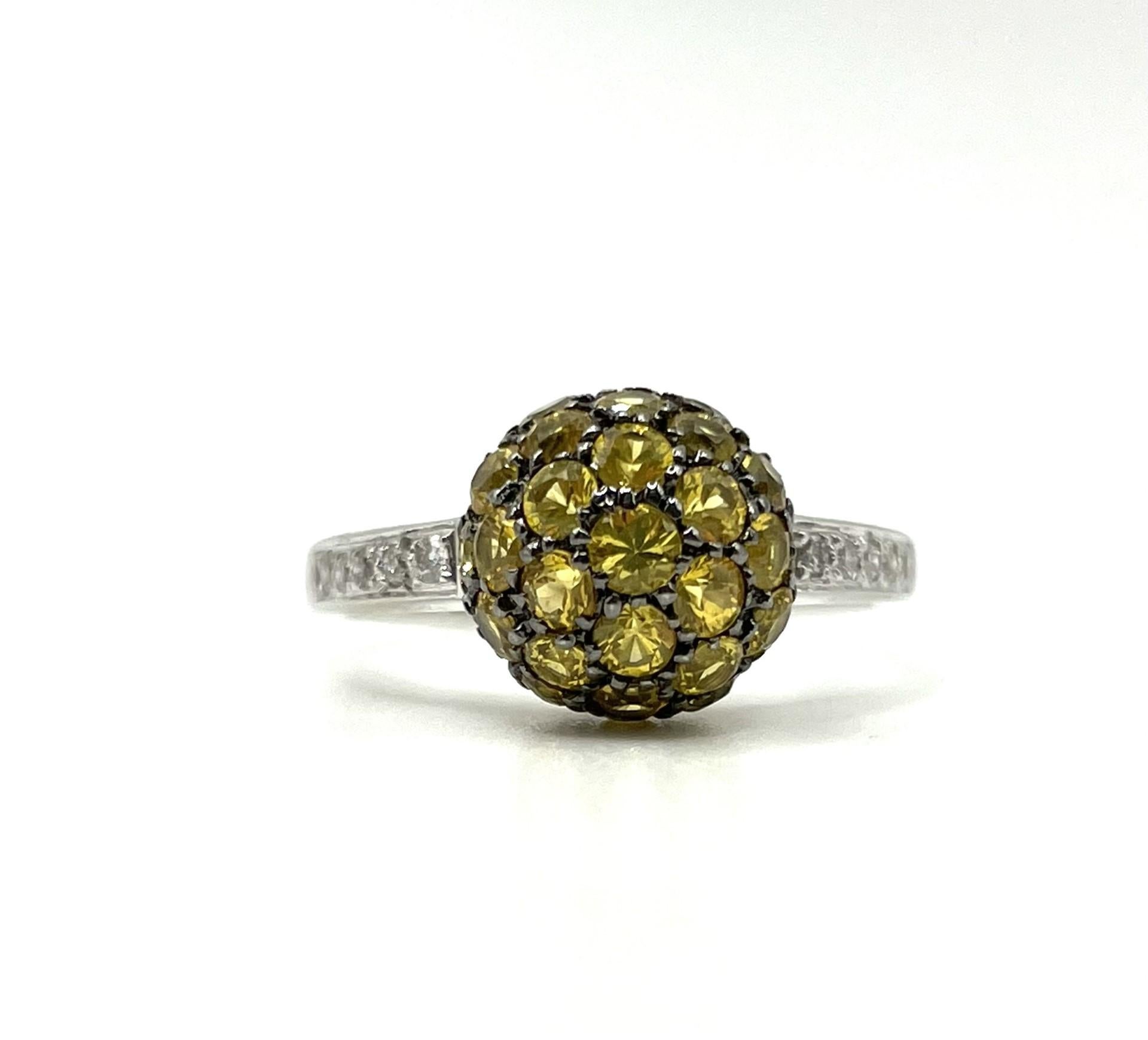 One 18kt white gold, natural yellow sapphire and diamond ball ring with a black rhodium finish around the yellow sapphires.

35 natural yellow sapphires 1.05ct total weight 

10 brilliant cut diamonds 0.20ct total weight

18kt white gold 4.2 grams