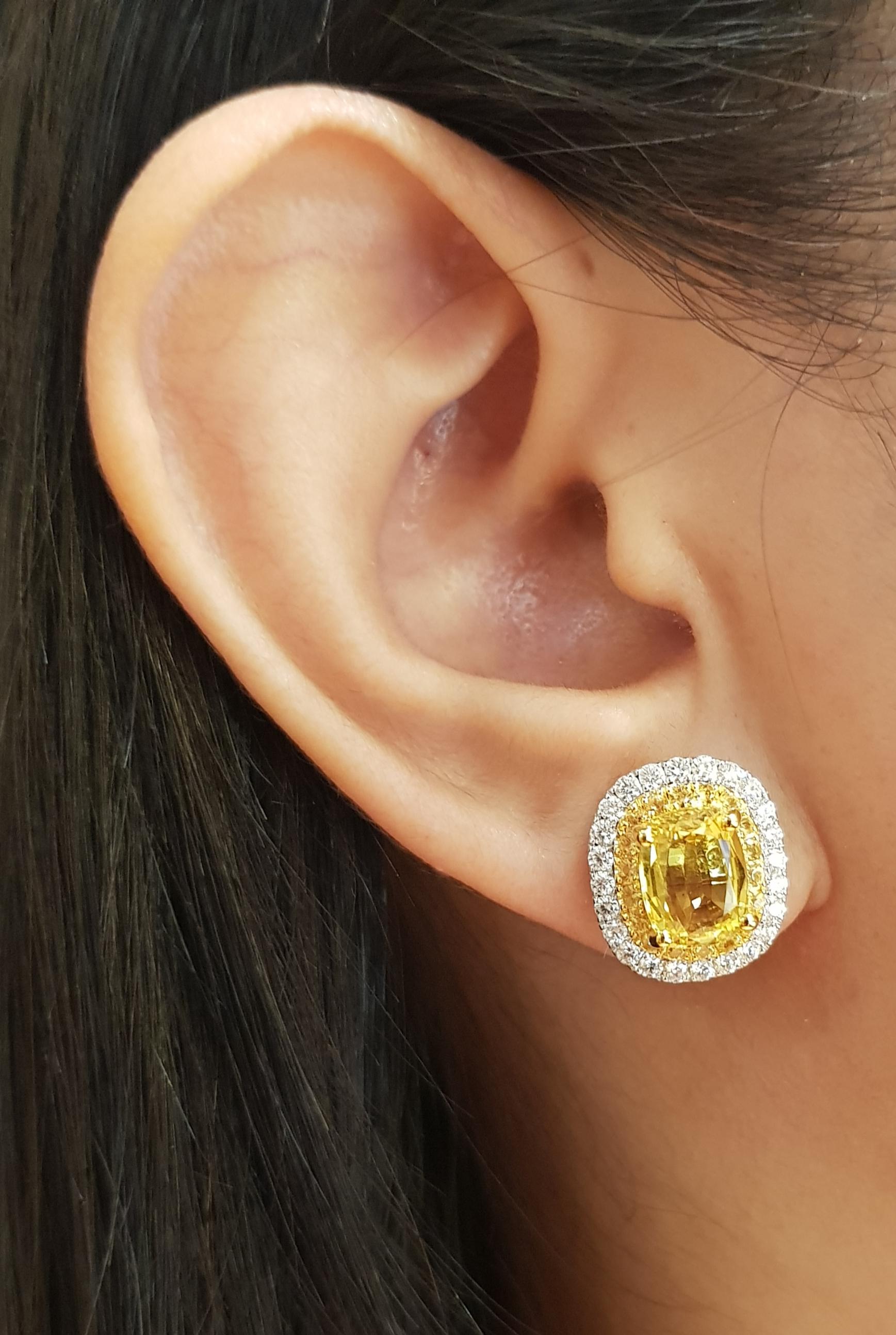 Yellow Sapphire 4.92 carats, Yellow Sapphire 0.69 carat and Diamond 0.80 carat Earrings set in 18K Gold/White Gold Settings

Width: 1.4 cm 
Length: 2.0 cm
Total Weight: 8.08 grams

