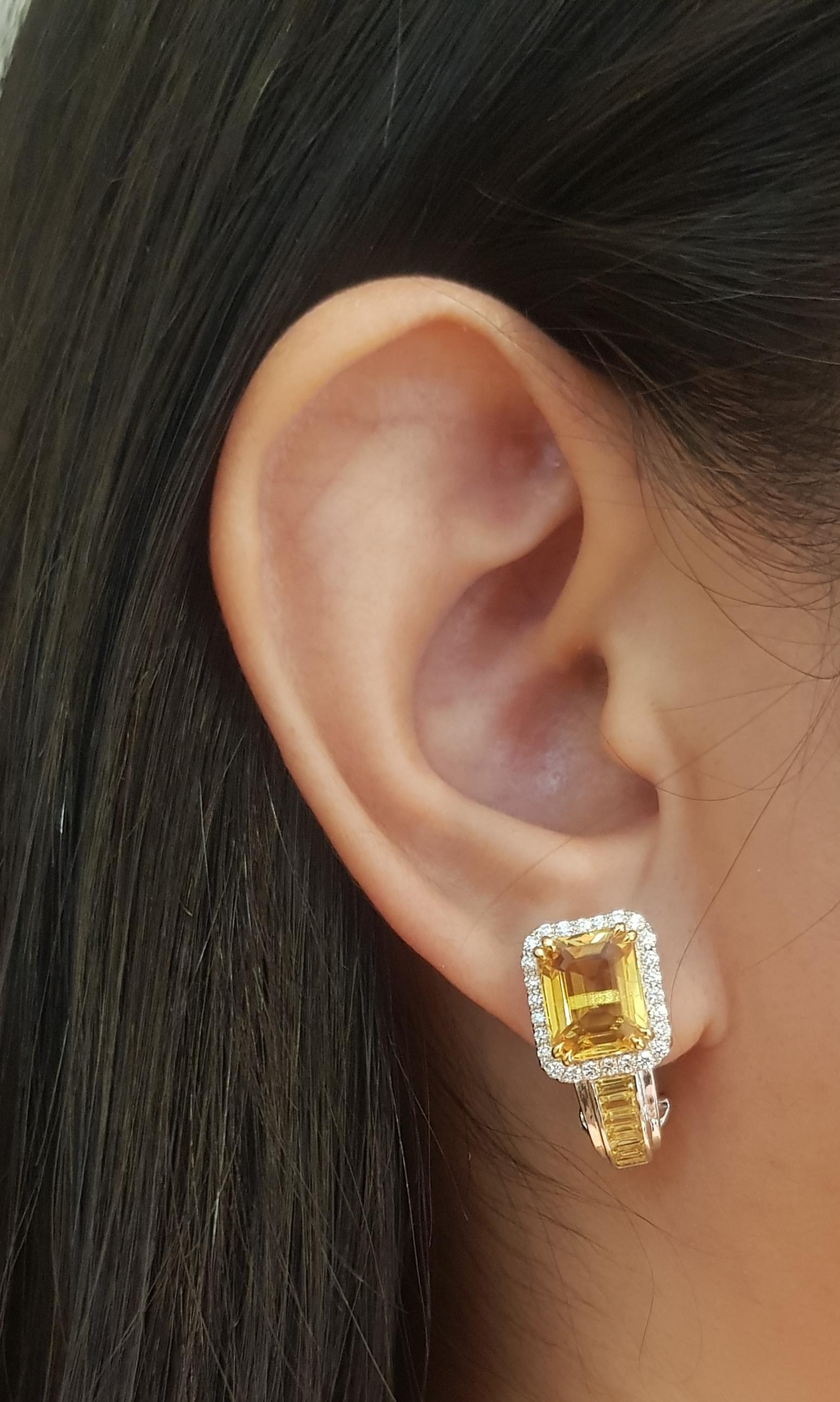 Yellow Sapphire 7.08 carats, Yellow Sapphire 1.78 carats and Diamond 0.54 carat Earrings set in 18K White Gold Settings

Width: 1.1 cm 
Length: 2.0 cm
Total Weight: 9.74 grams

