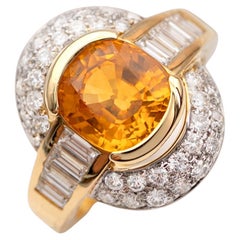 Goldring mit gelbem Saphir und Diamant