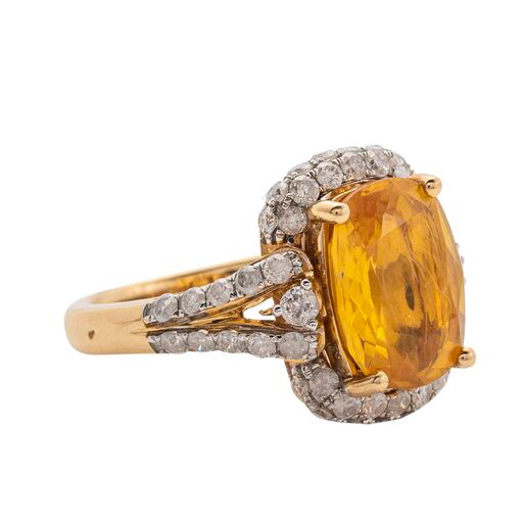 Yellow Sapphire and Diamond Ring 
Yellow Sapphire weighing approximately 5.59 cts 
Diamonds weighing approximately 1.21 cts 
7.50 grams (gross), size 7 

Accompanied with AIG paperwork stating: 
14K yellow gold ladies Yellow Sapphire and Diamond