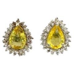 Pear Cut Yellow Sapphire Halo Diamond Stud Earrings in Sterling Silver