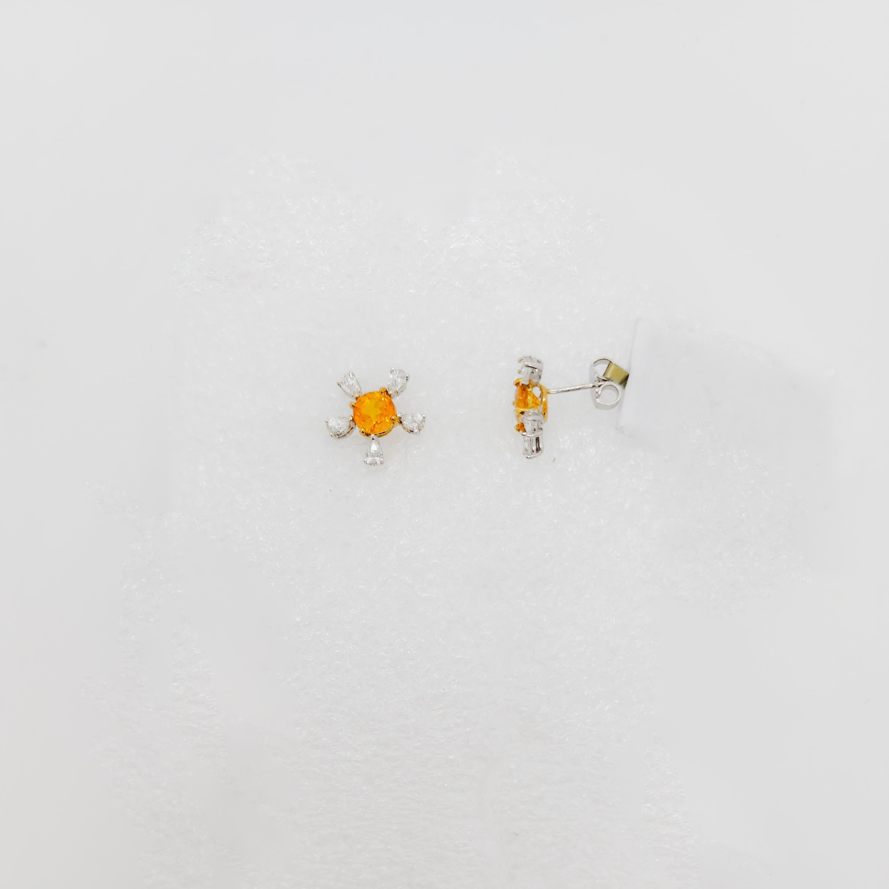 Beautiful 1.94 ct. yellow sapphire rounds with 1.01 ct. good quality white diamond pear shapes.  Handmade in 18k white and yellow gold.  